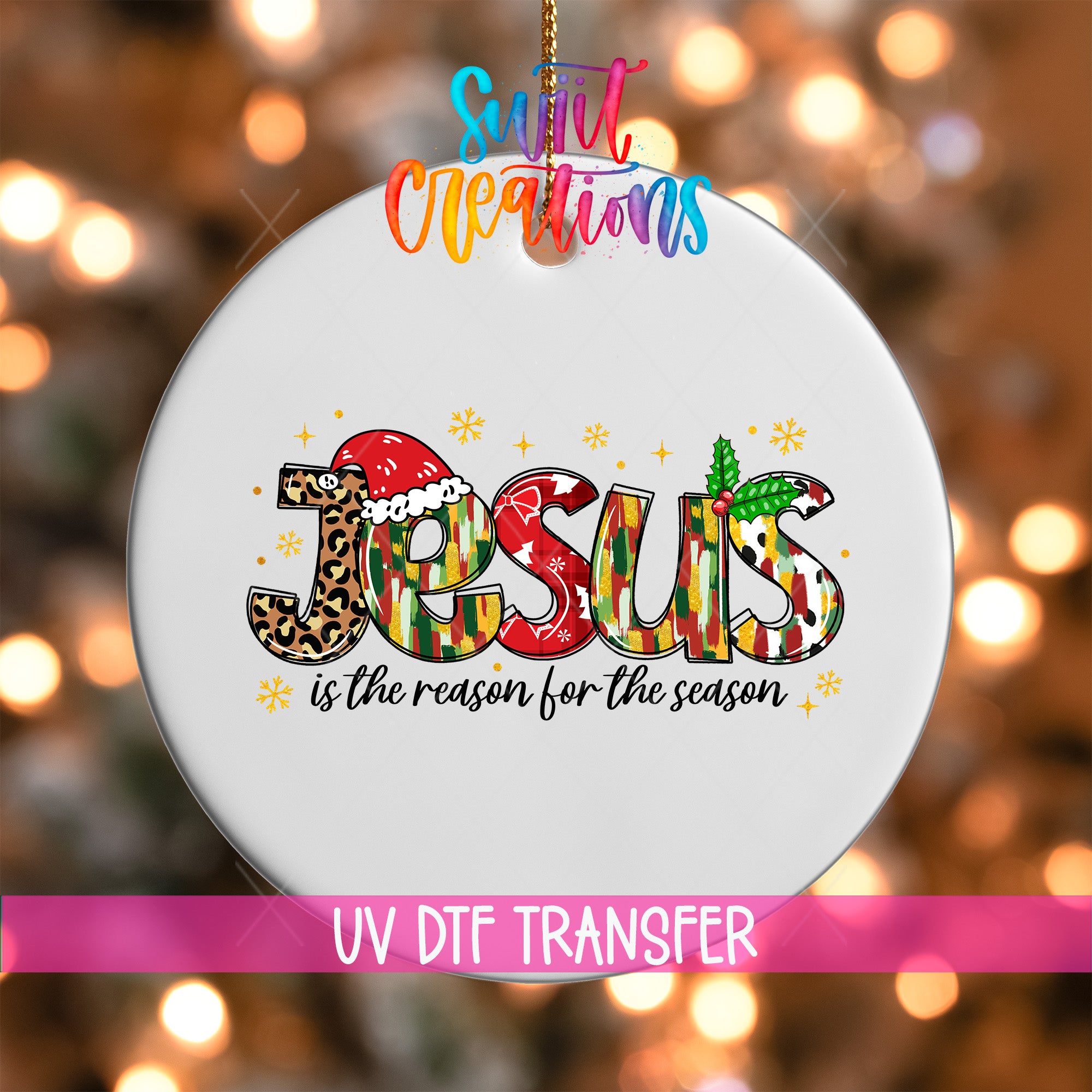 A white ornament with the word "JESUS" written on it, surrounded by various holiday-themed elements such as snowflakes and a leopard print.