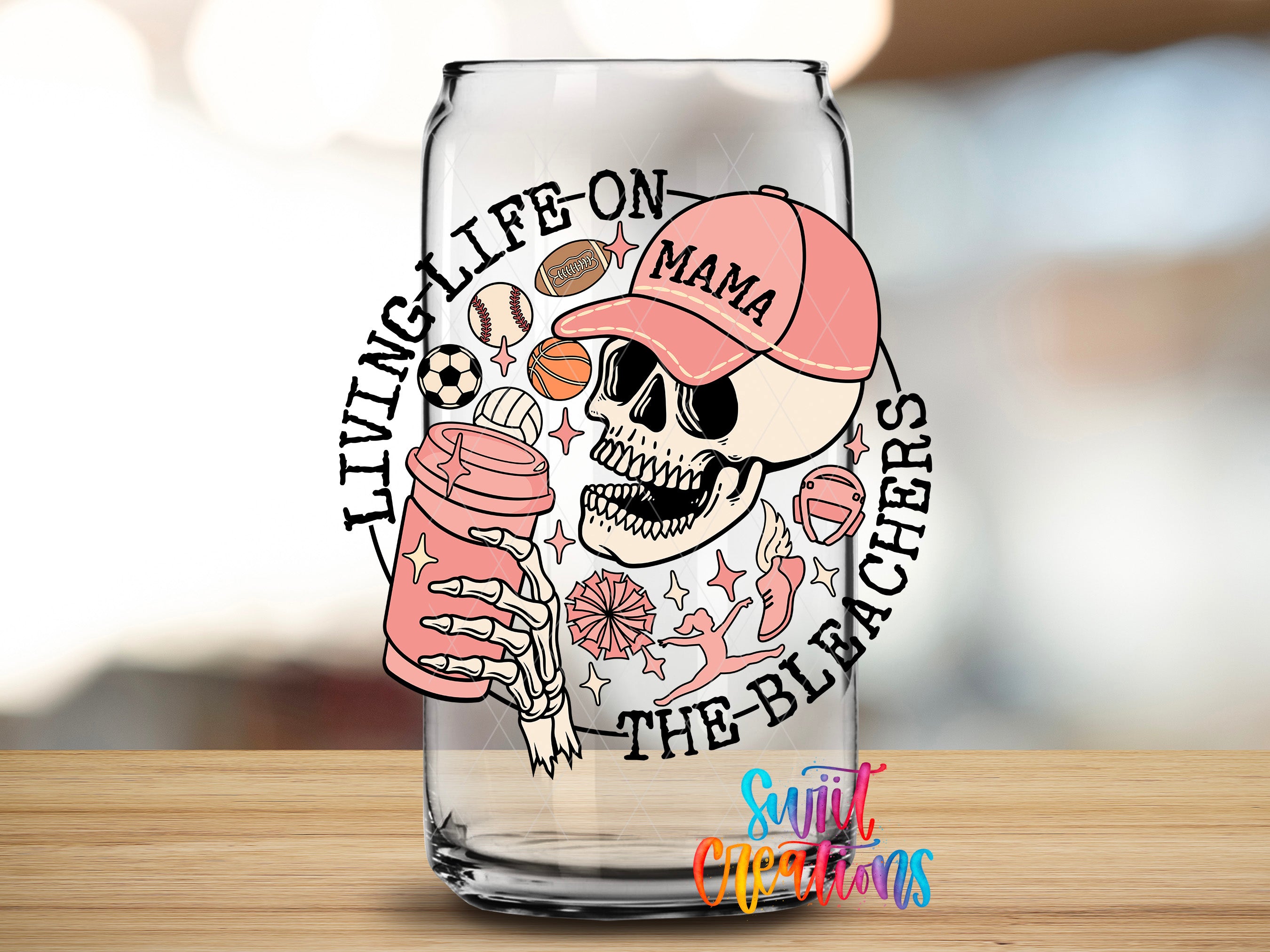 A glass with a design featuring a skeleton wearing a baseball cap and holding a can of soda, surrounded by various sports-related icons.