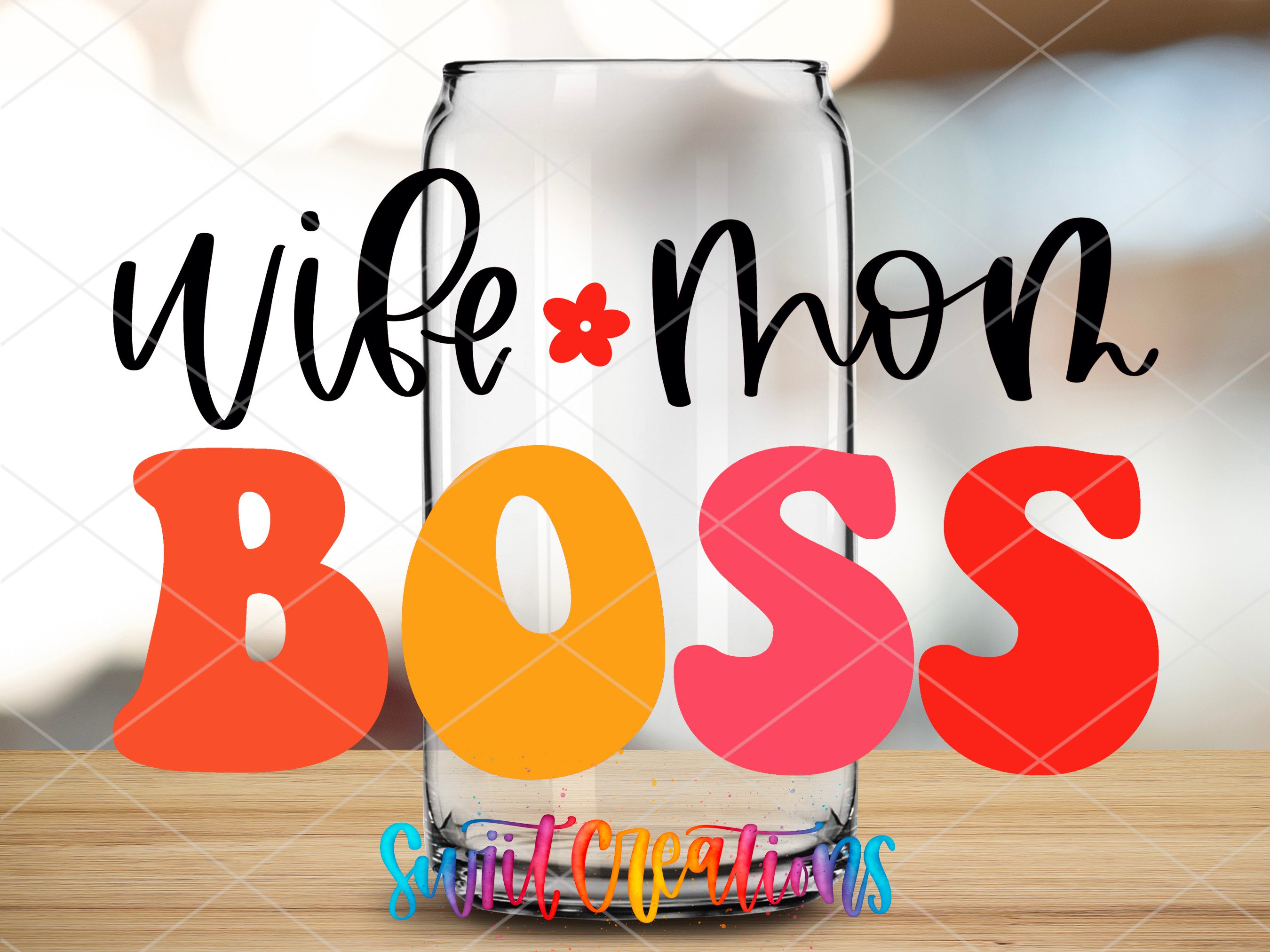 a glass jar with the words wife mom boss on it