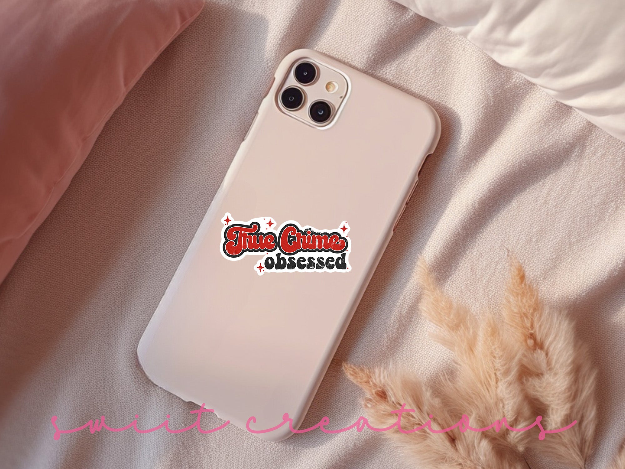 a white phone case with a red and black sticker on it