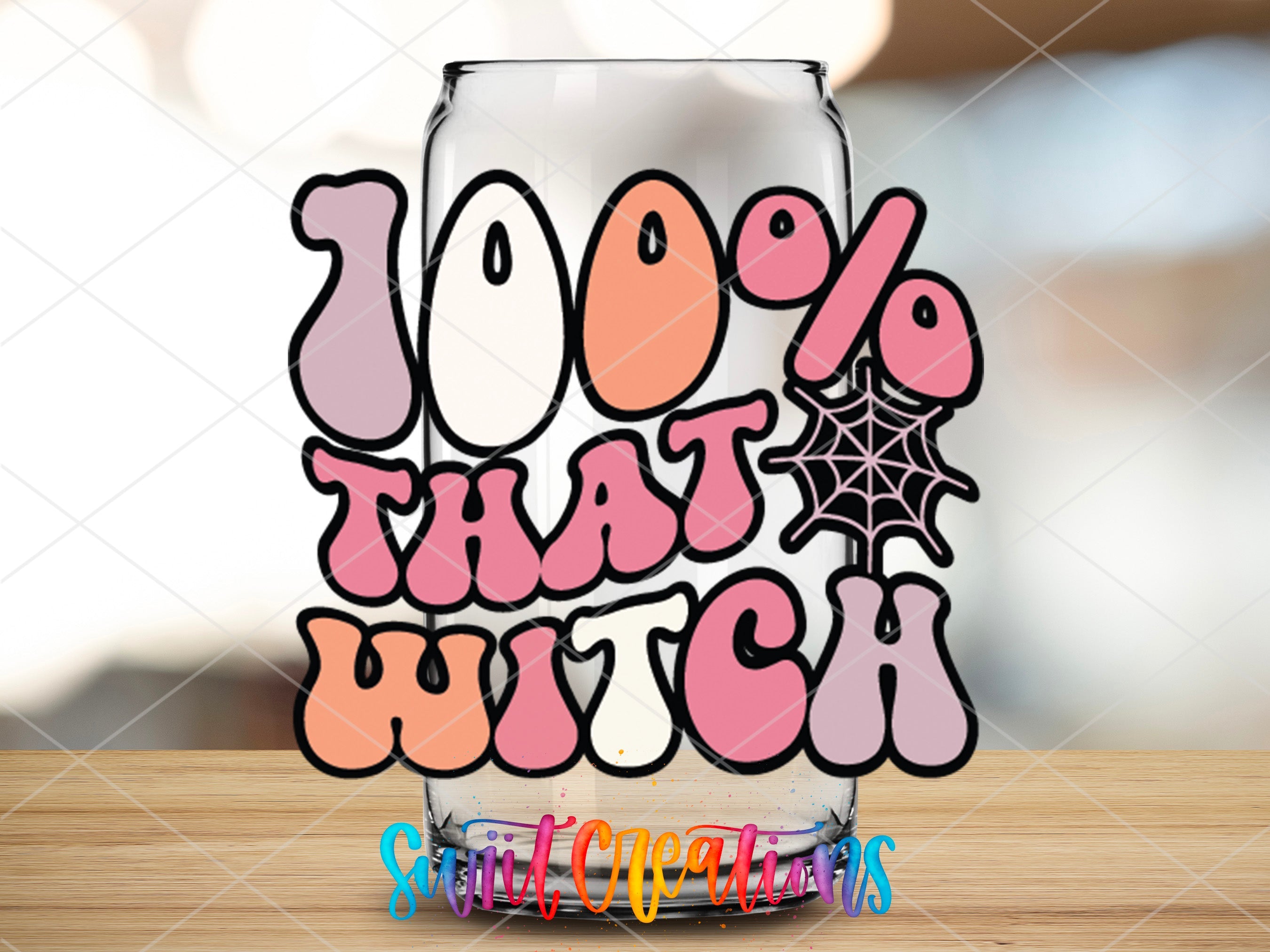 a glass with the words 100 % that witch on it