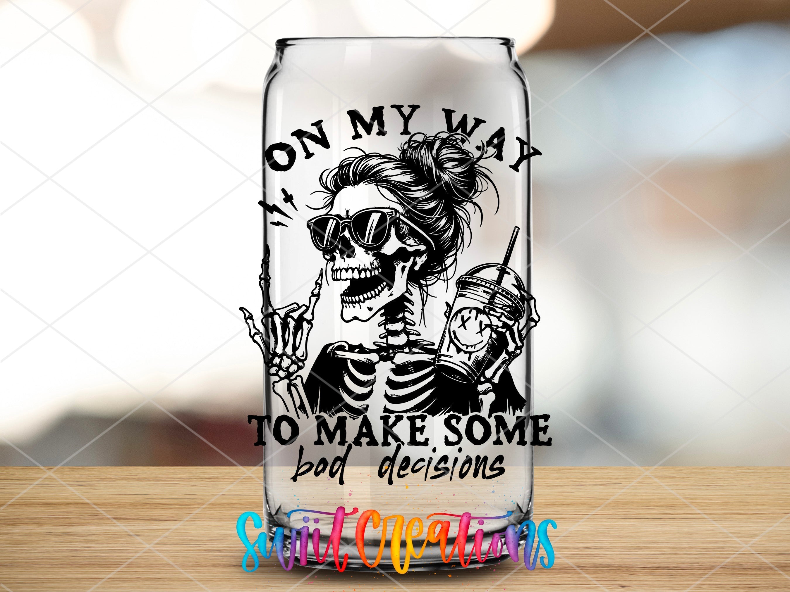 a glass with a picture of a skeleton on it