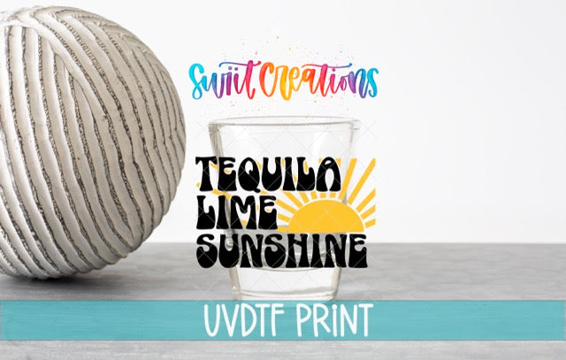 a ball of yarn next to a glass of water