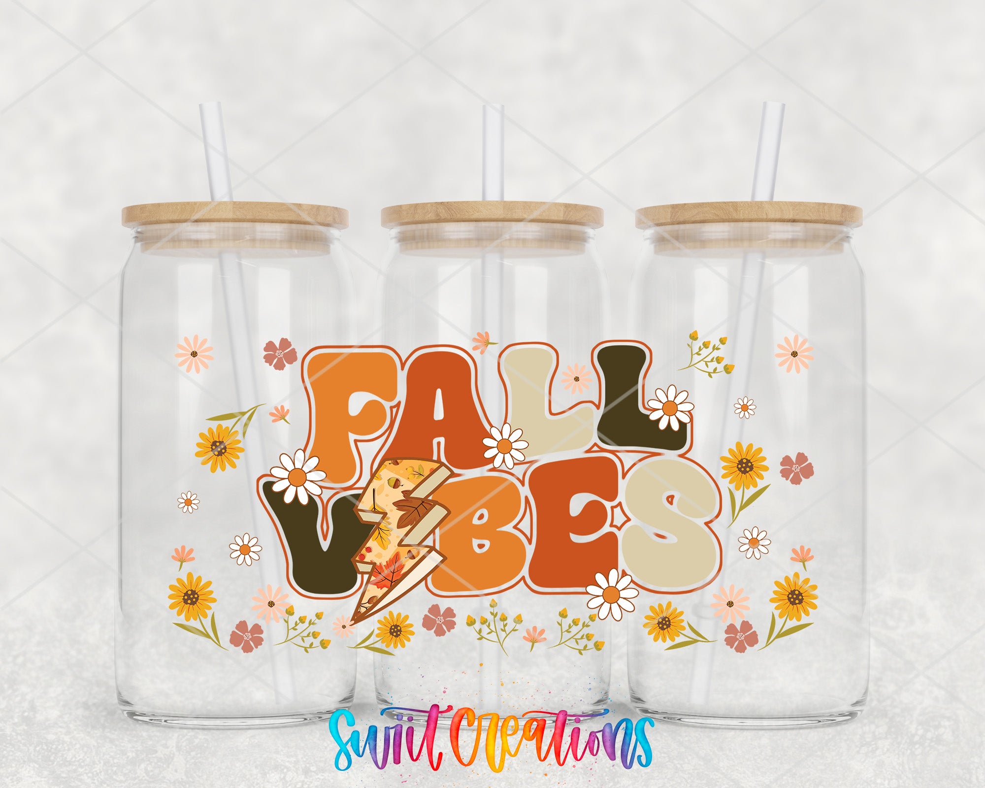 three glass jars with wooden lids, each containing a straw. The jars are decorated with a colorful design that includes the text "FALL VIBES" and various floral elements.