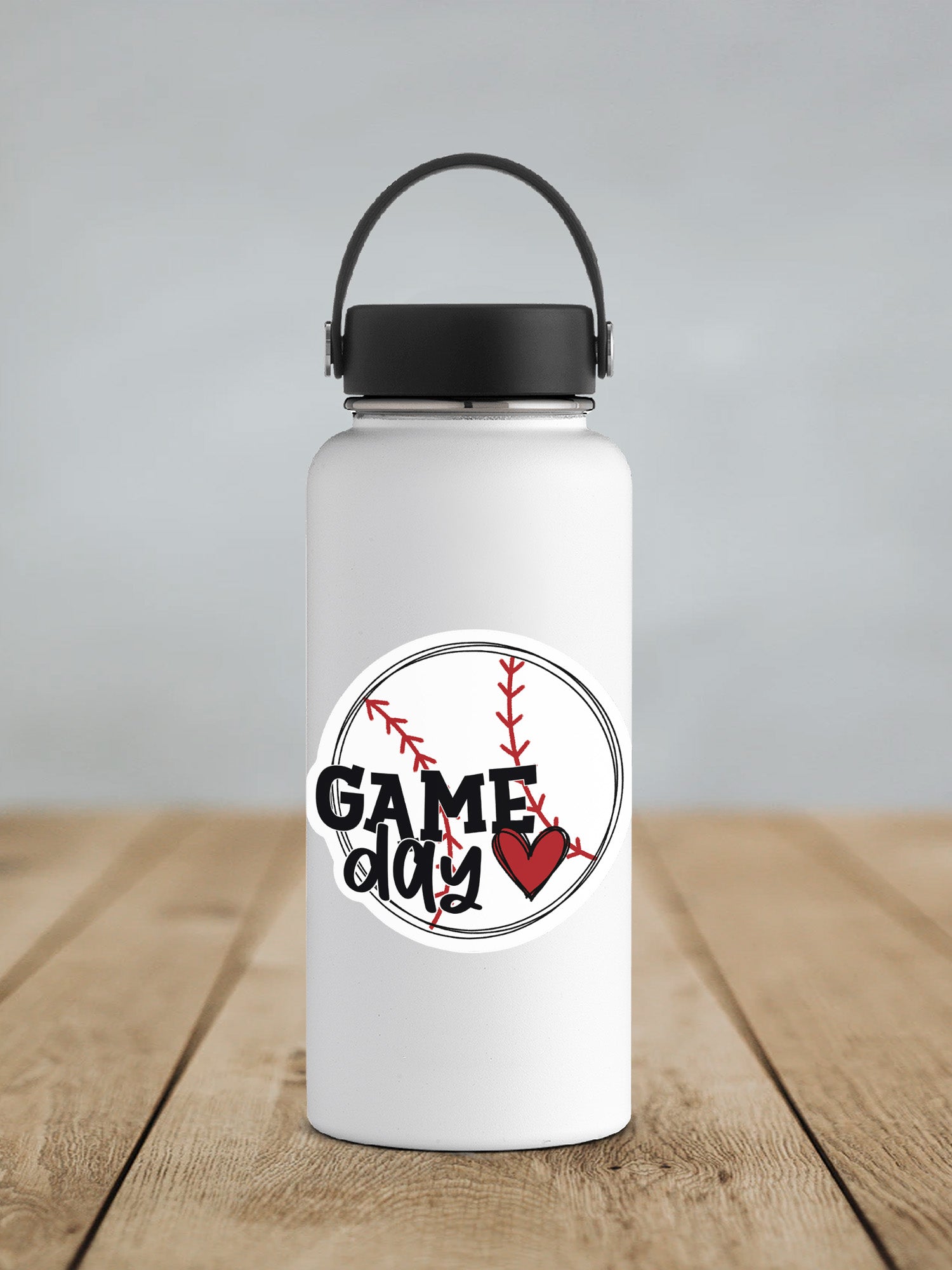 a white water bottle with a black lid on a wooden table