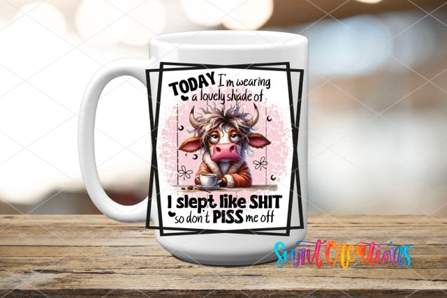 a coffee mug with a picture of a cow on it