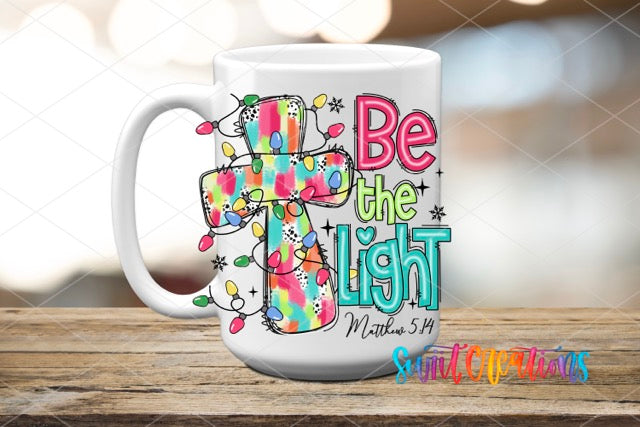 a white coffee mug with a cross on it