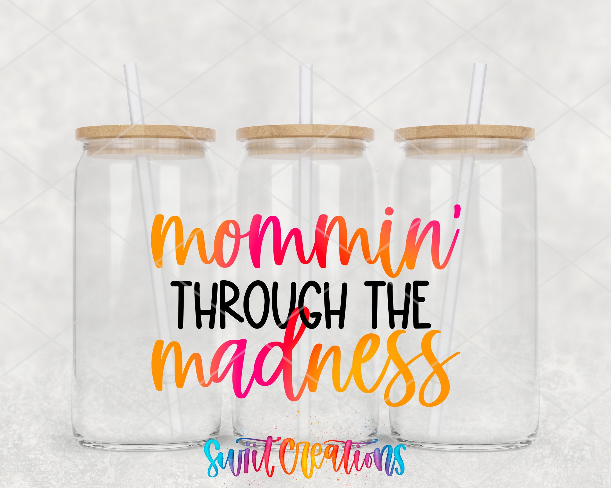 two clear tumblers with the words mommy through the mardi gras on them