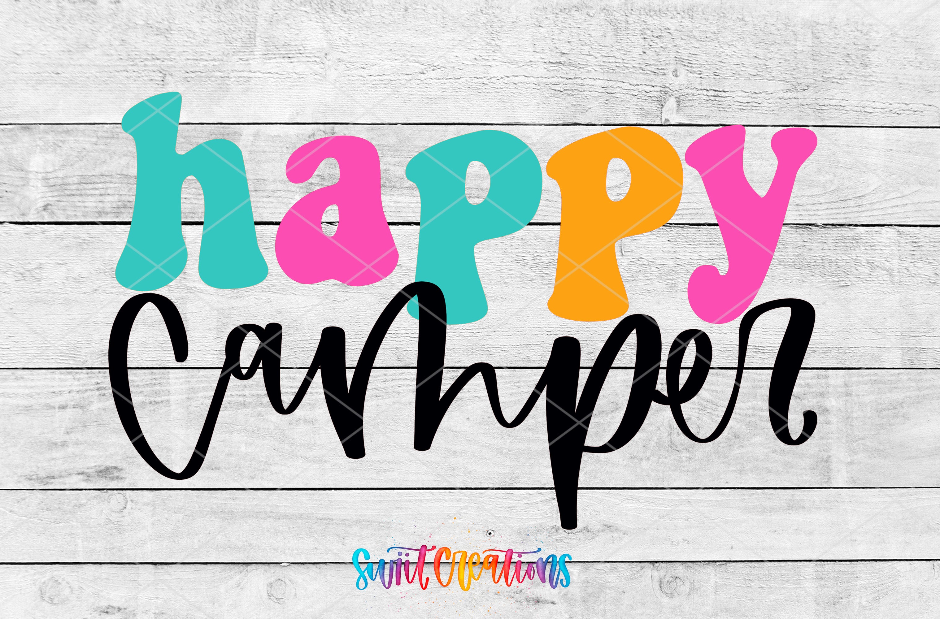the text "Happy Camper" in a colorful, stylized font against a white wooden background.