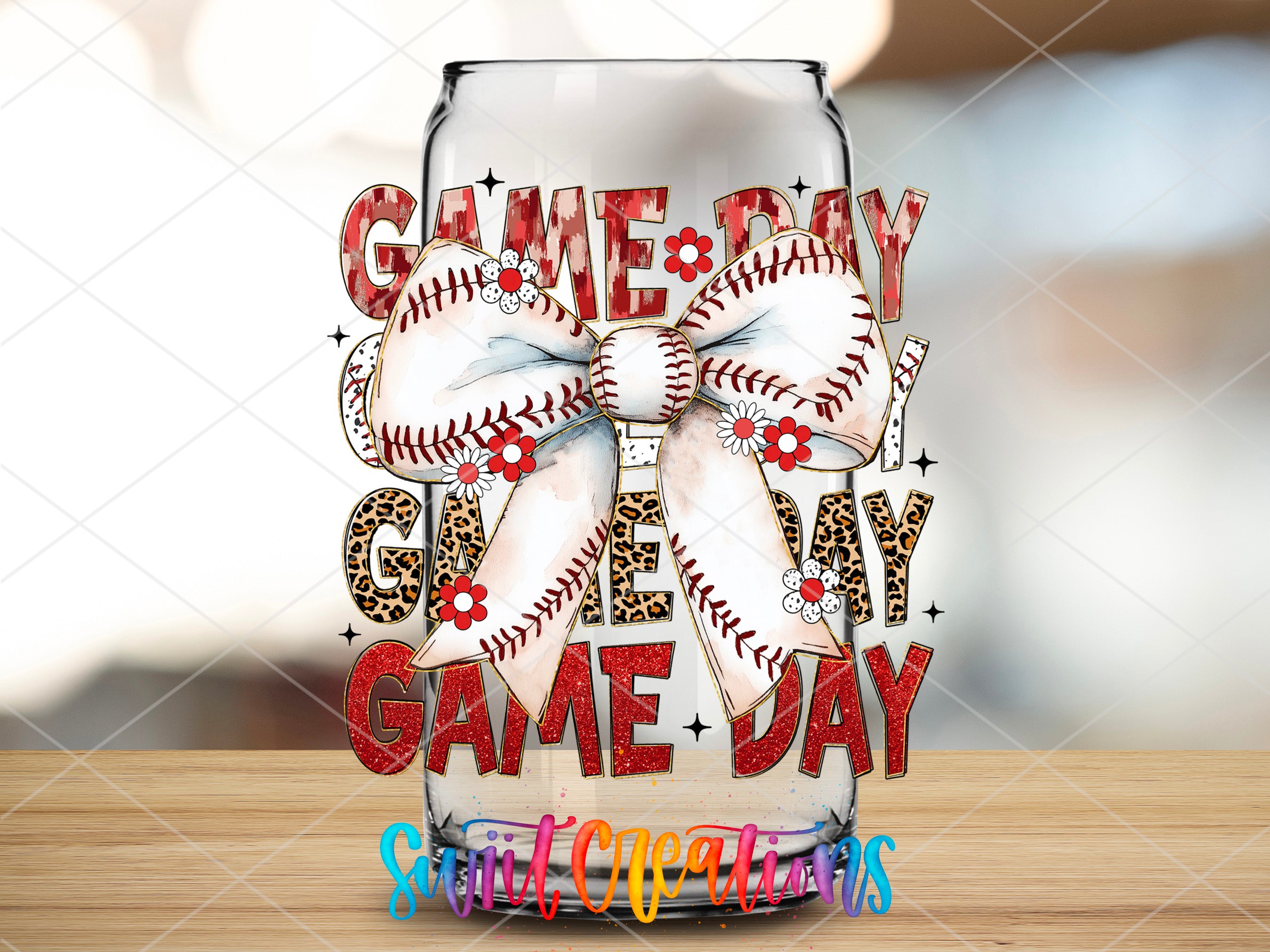 a glass with a baseball themed bow on it