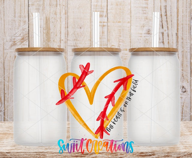 a couple of cups sitting on top of a wooden table