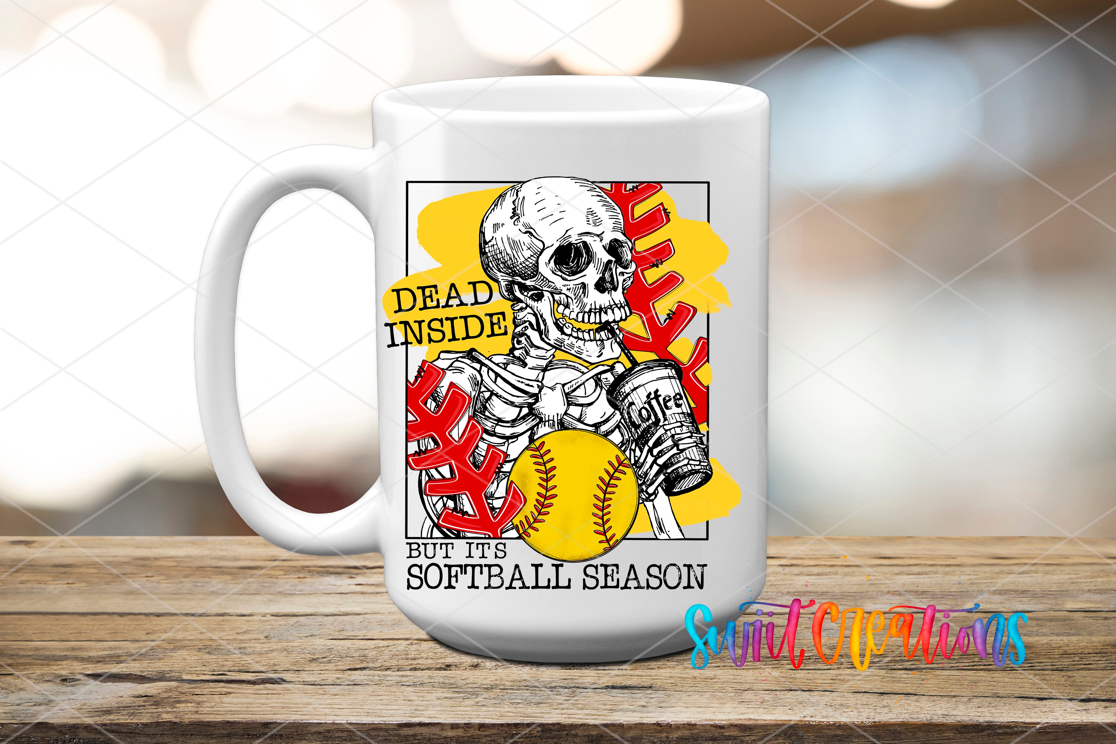 A white mug with a graphic design featuring a skeleton holding a softball and the text "Dead inside, put it's softball season" printed on it.