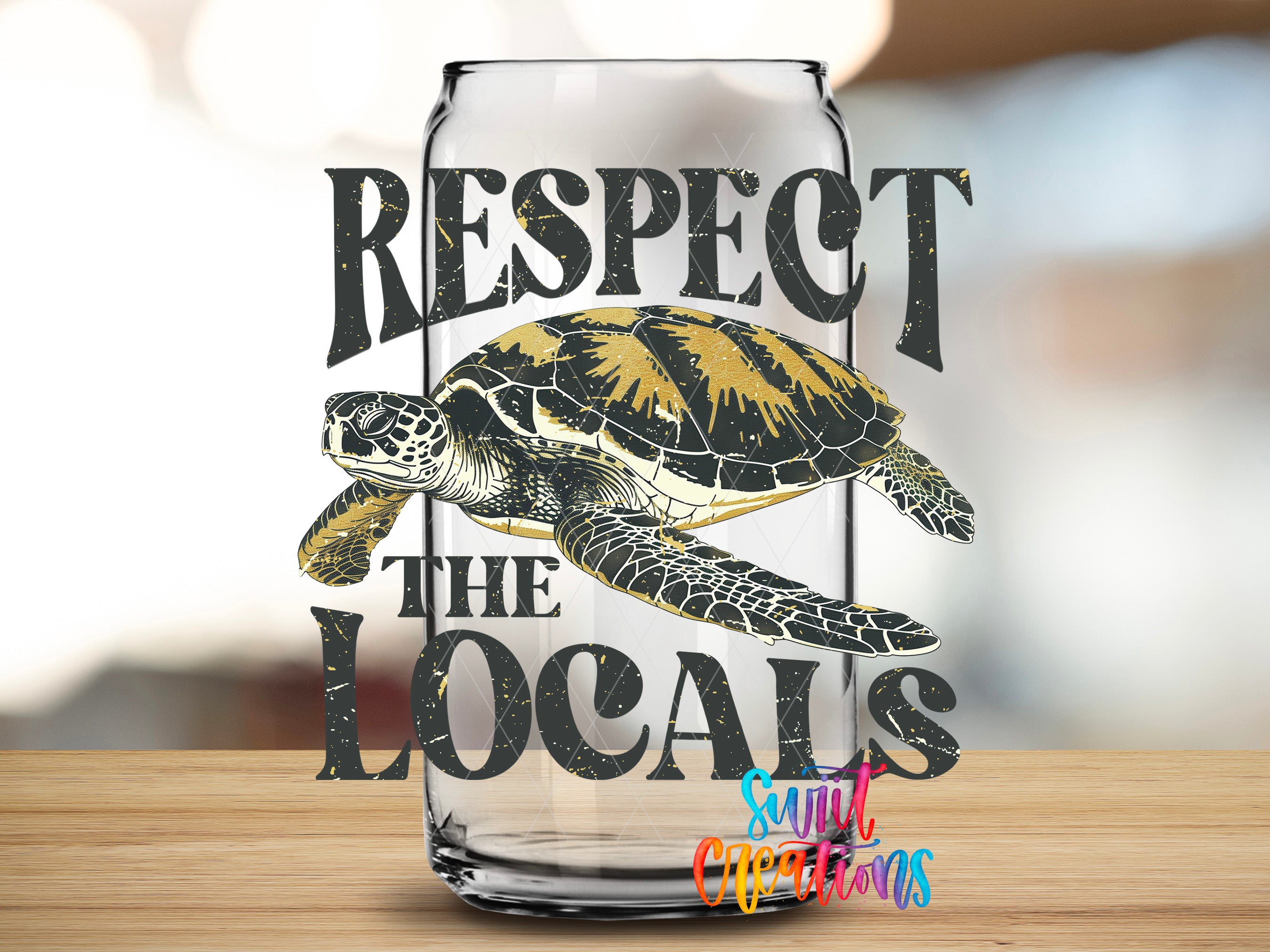 a clear glass can with a printed design on it, depicting a turtle and the text "RESPECT THE LOCAINS" in a stylized font.