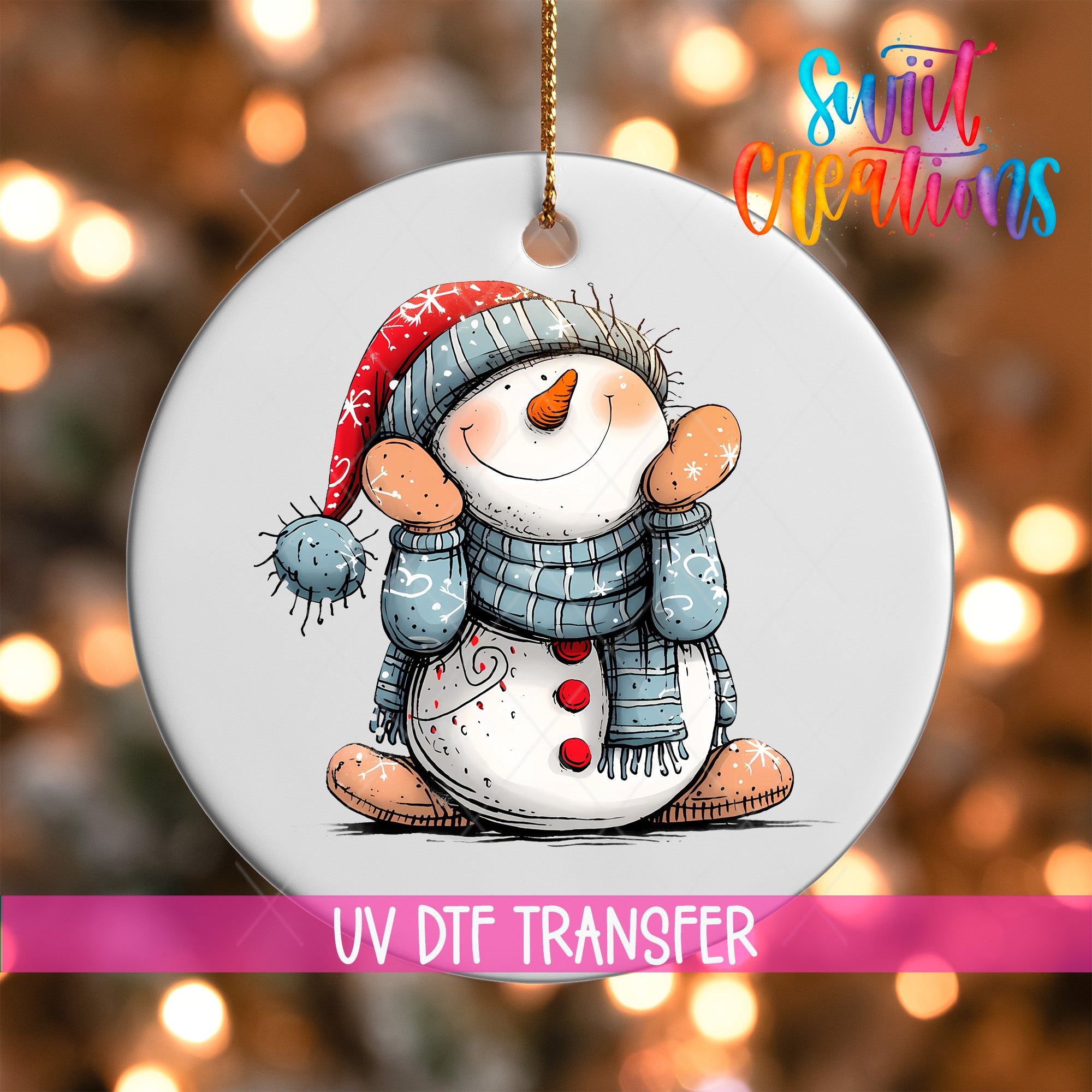 A snowman ornament with a red hat and blue scarf, sitting on a white background with a blurred background of lights.