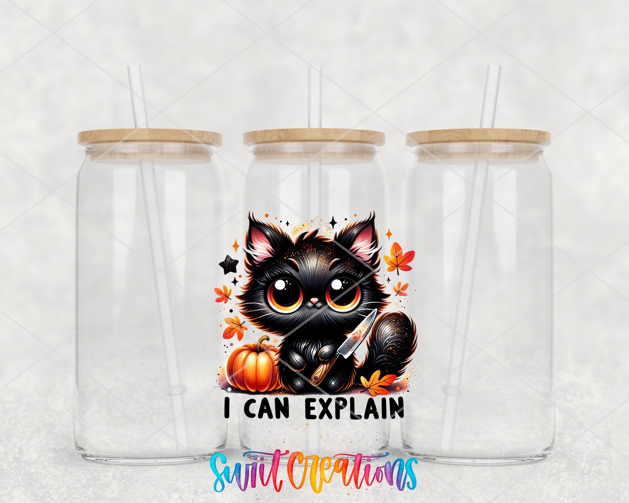 two clear tumblers with a black cat and pumpkins on them