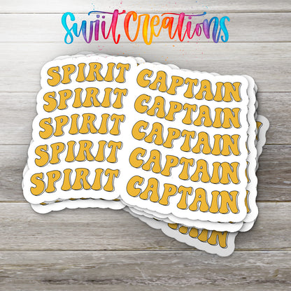 A stack of yellow stickers with the word "SPIRIT" repeated in a playful font, arranged on a wooden surface.