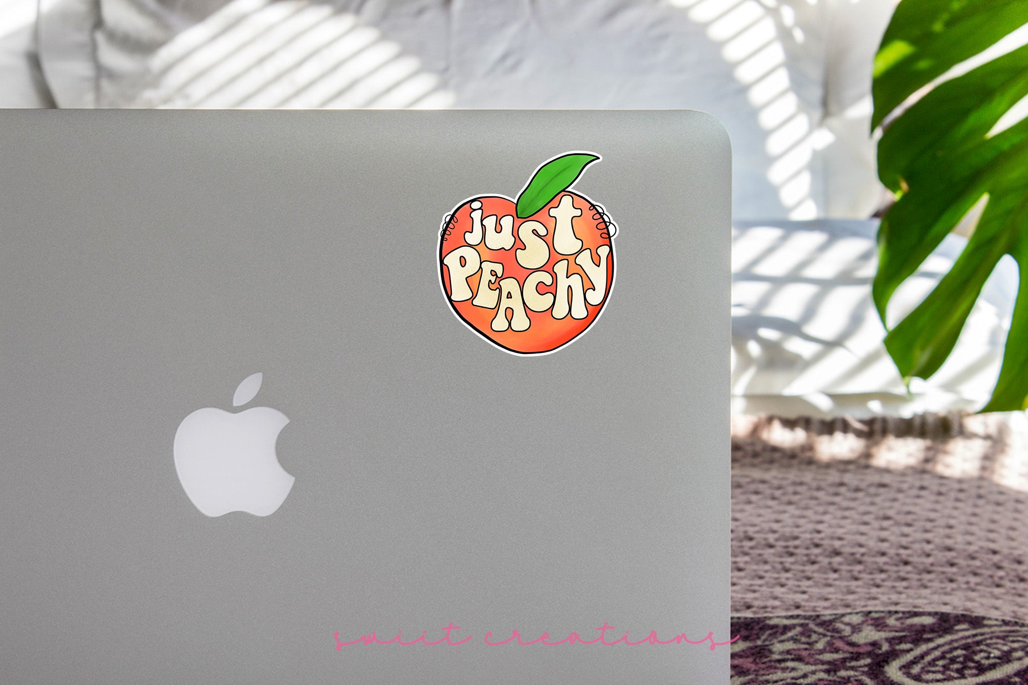 a laptop with a sticker of an apple on it