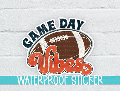Football Game Day Vibes sticker on a white brick background with a waterproof sticker banner