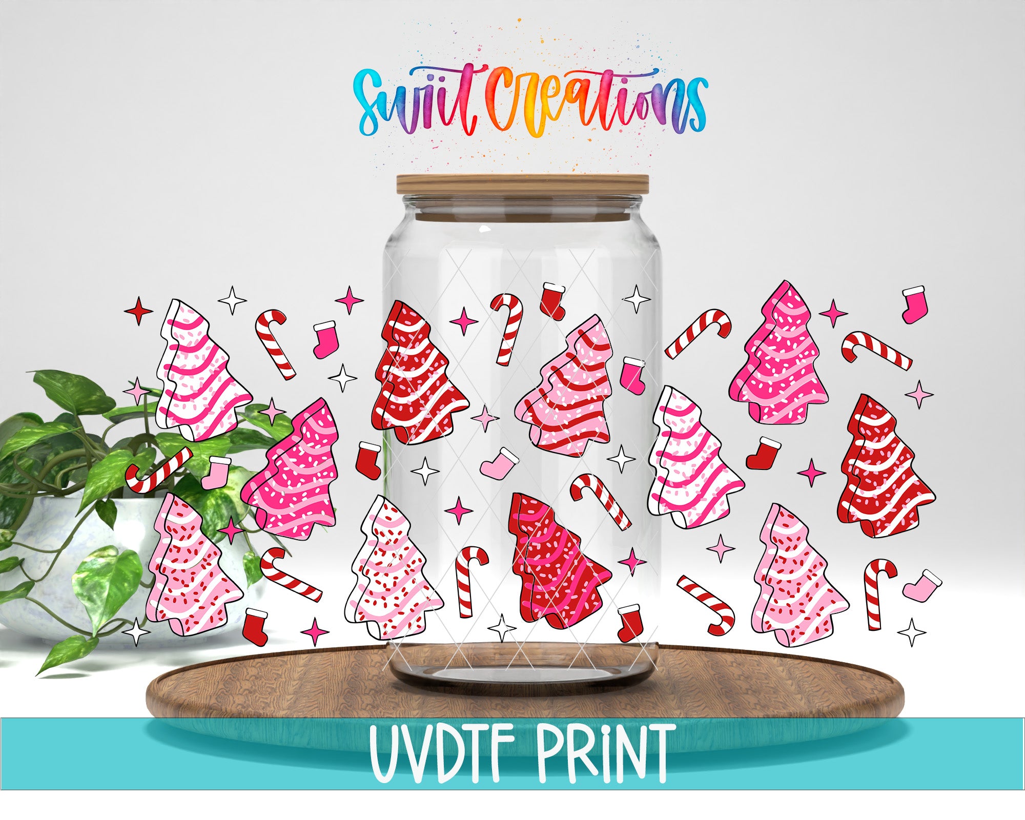 a glass jar with a lid, decorated with various Christmas-themed illustrations such as candy canes, stockings, and trees. The jar is placed on a wooden surface, and there is a plant in the background. The text "Swift Creations" is written above the jar, and "UVDF PRINT" is written below it.