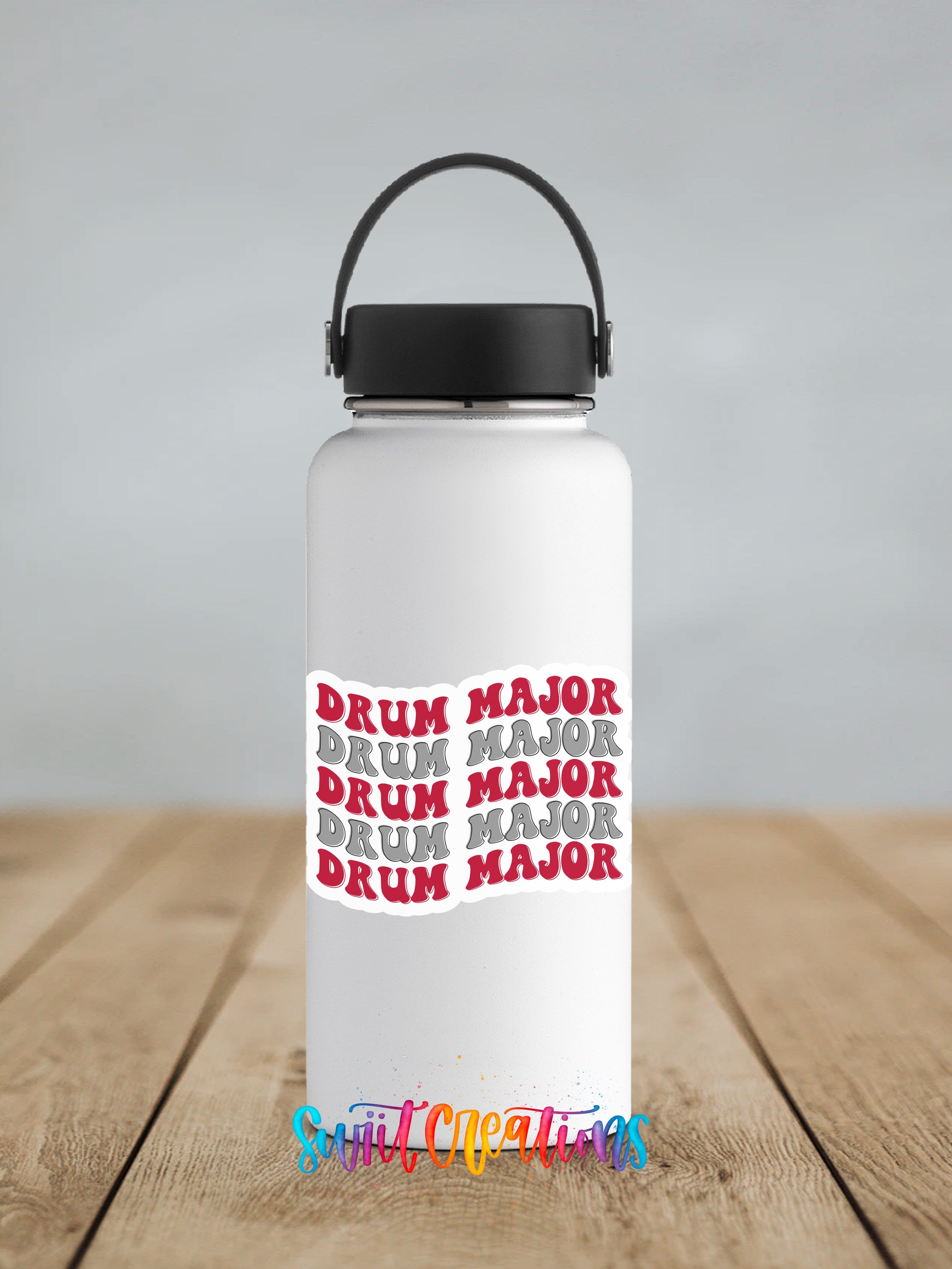 A white water bottle with a black handle and a red and white text design on it, placed on a wooden surface.