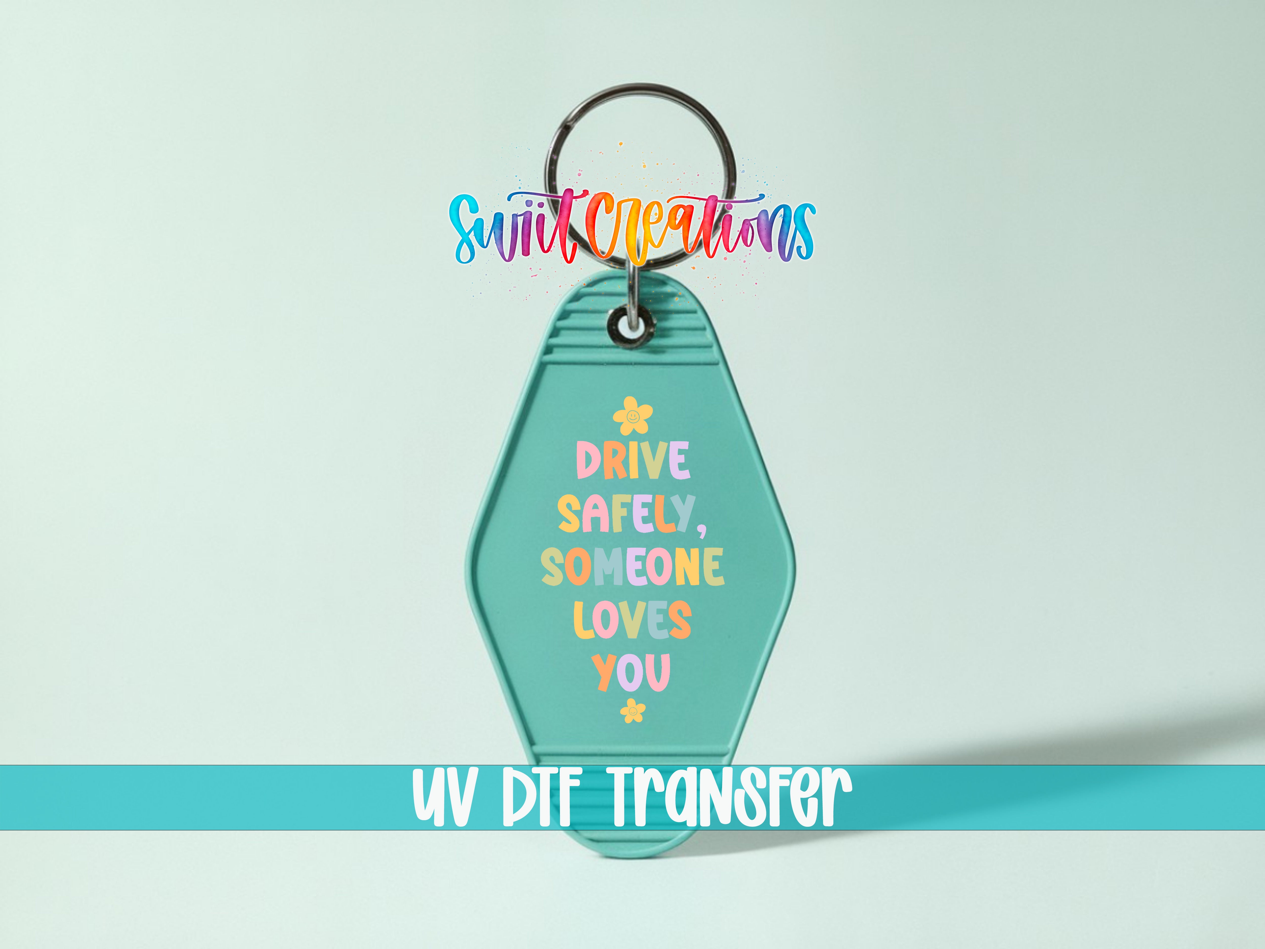 A keychain with a message about driving safely and loving someone, along with a UV DIF Transfer logo.
