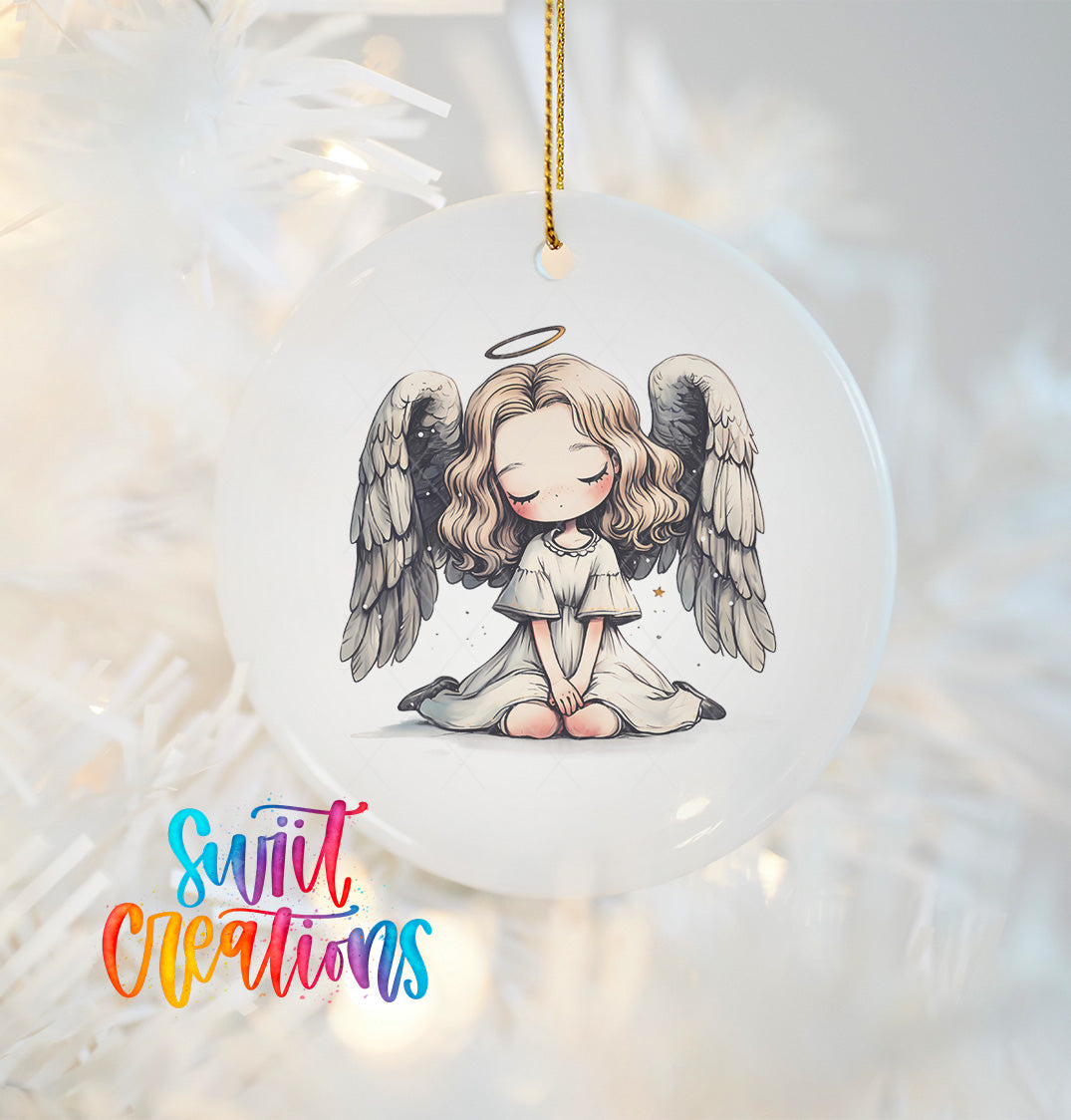 A white ceramic ornament featuring a cartoon illustration of a young girl with angelic features, including wings and a halo, sitting in a meditative pose.