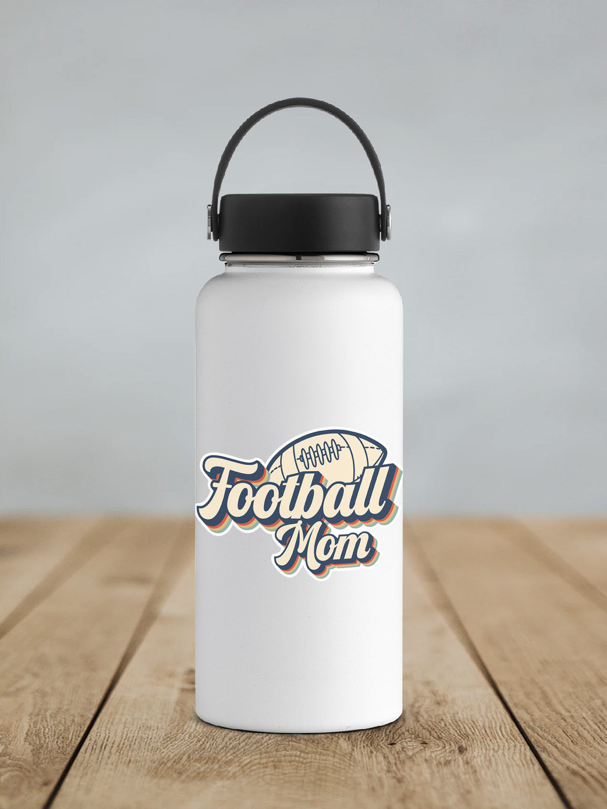 Football Mom sticker on a white insulated water bottle