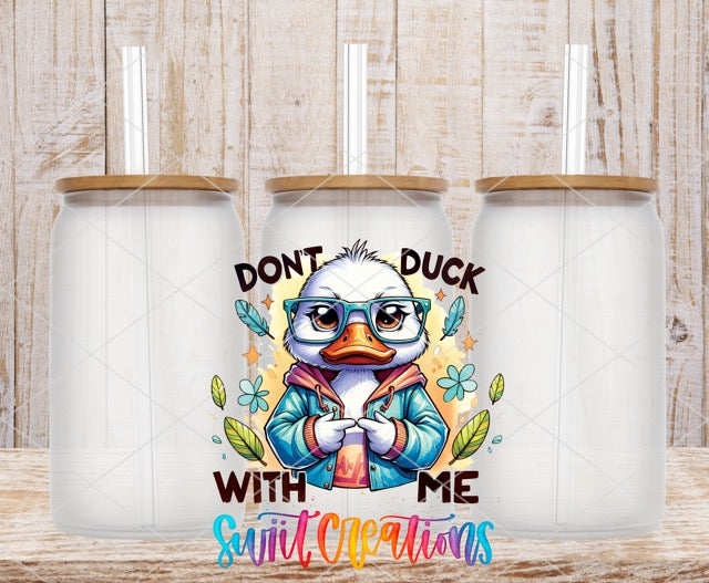 two white coffee mugs with the words don't duck with me and a
