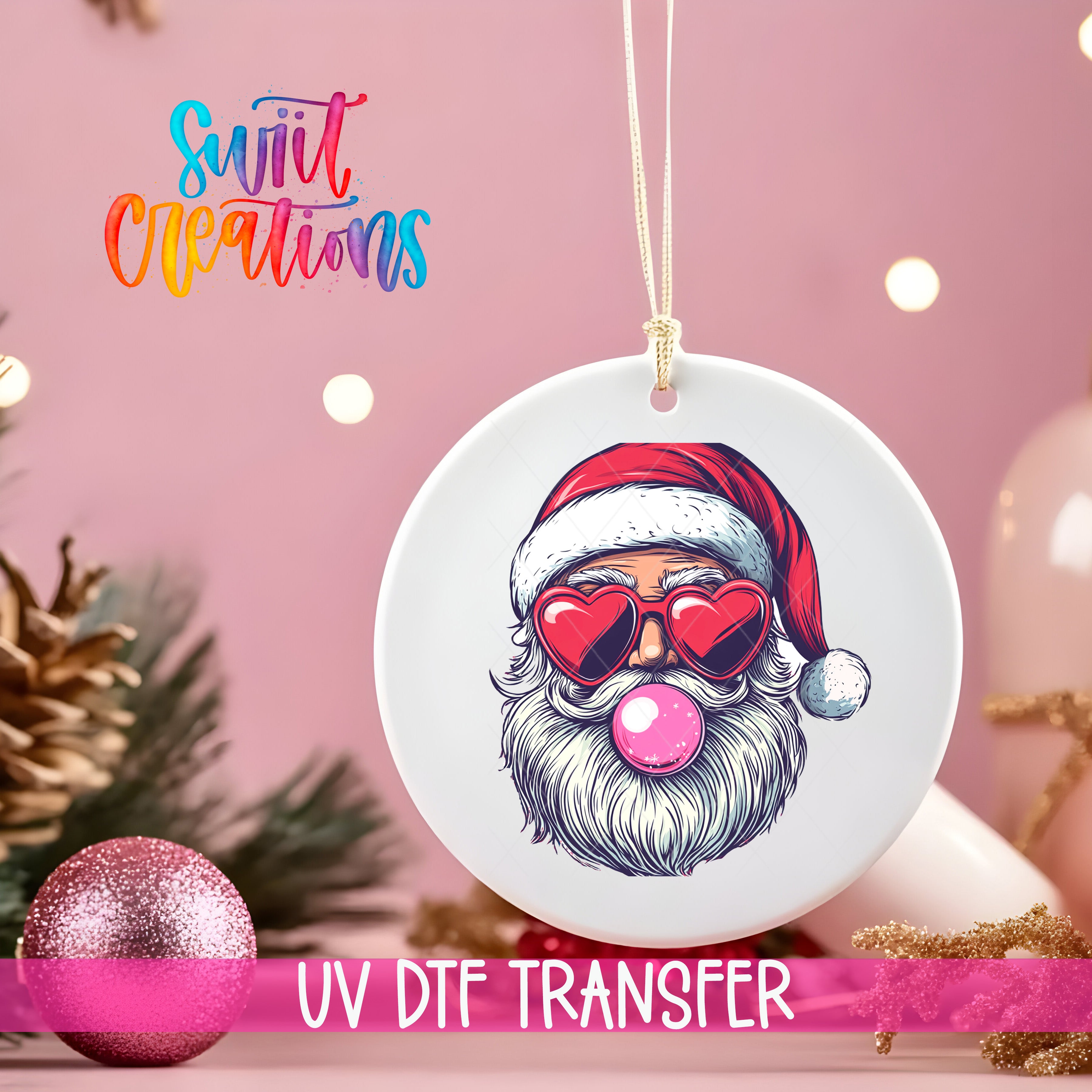 A white ornament with a Santa Claus face wearing sunglasses and a red hat, along with a pink bubble gum bubble, is hanging on a string. The ornament is placed on a pink background, and there are Christmas decorations in the background.
