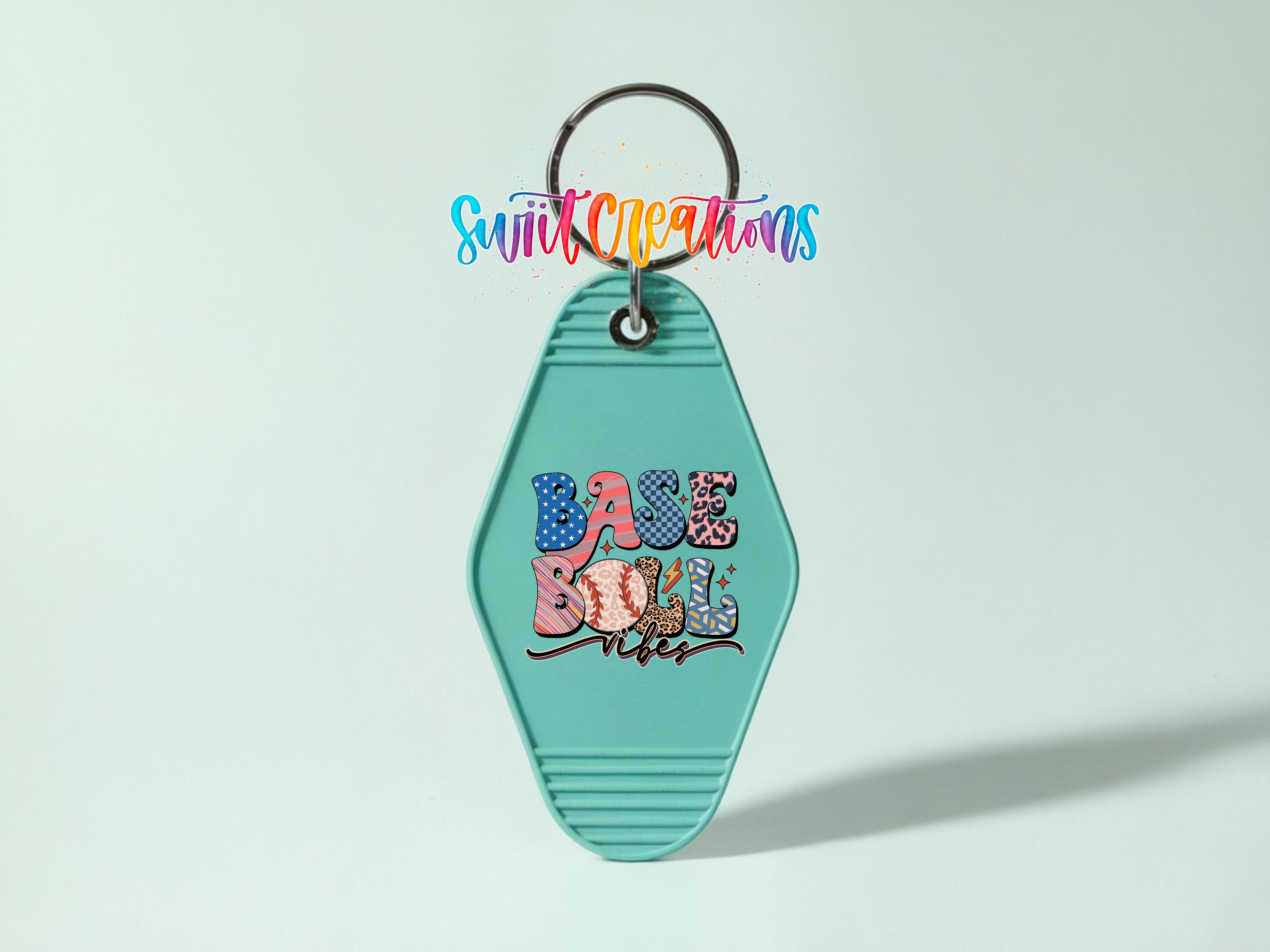 A keychain with the text "Base Ball" printed on it, along with a colorful, stylized design.