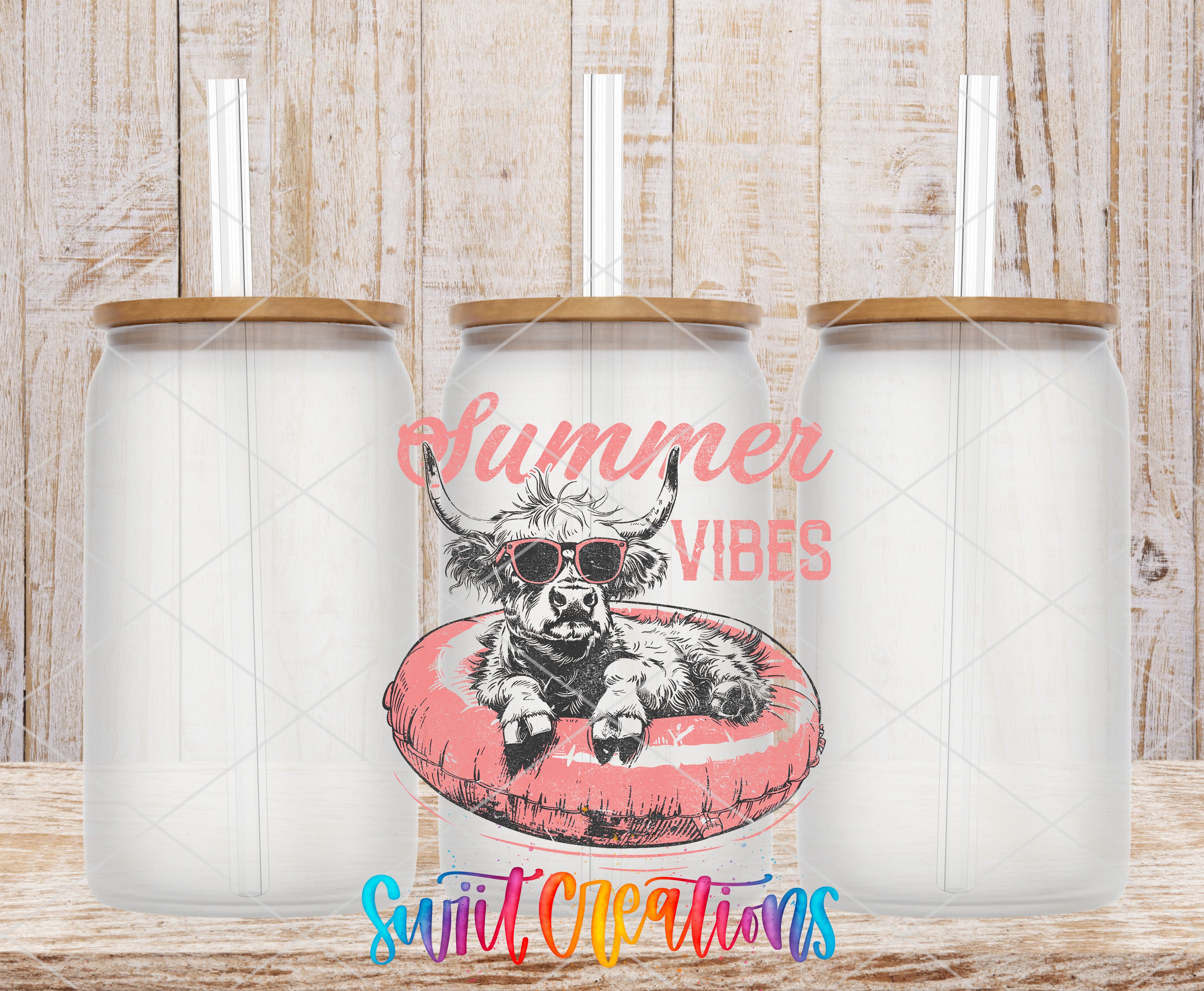 three clear glass tumblers with straws, each with a lid and a straw. The tumblers are arranged in a row, and there is a printed design on the center tumbler depicting a cow wearing sunglasses and laying on a red inner tube. The text "Summer VIBES" is printed on the tumbler, and the phrase "Swift Creations" is printed below the tumbler.