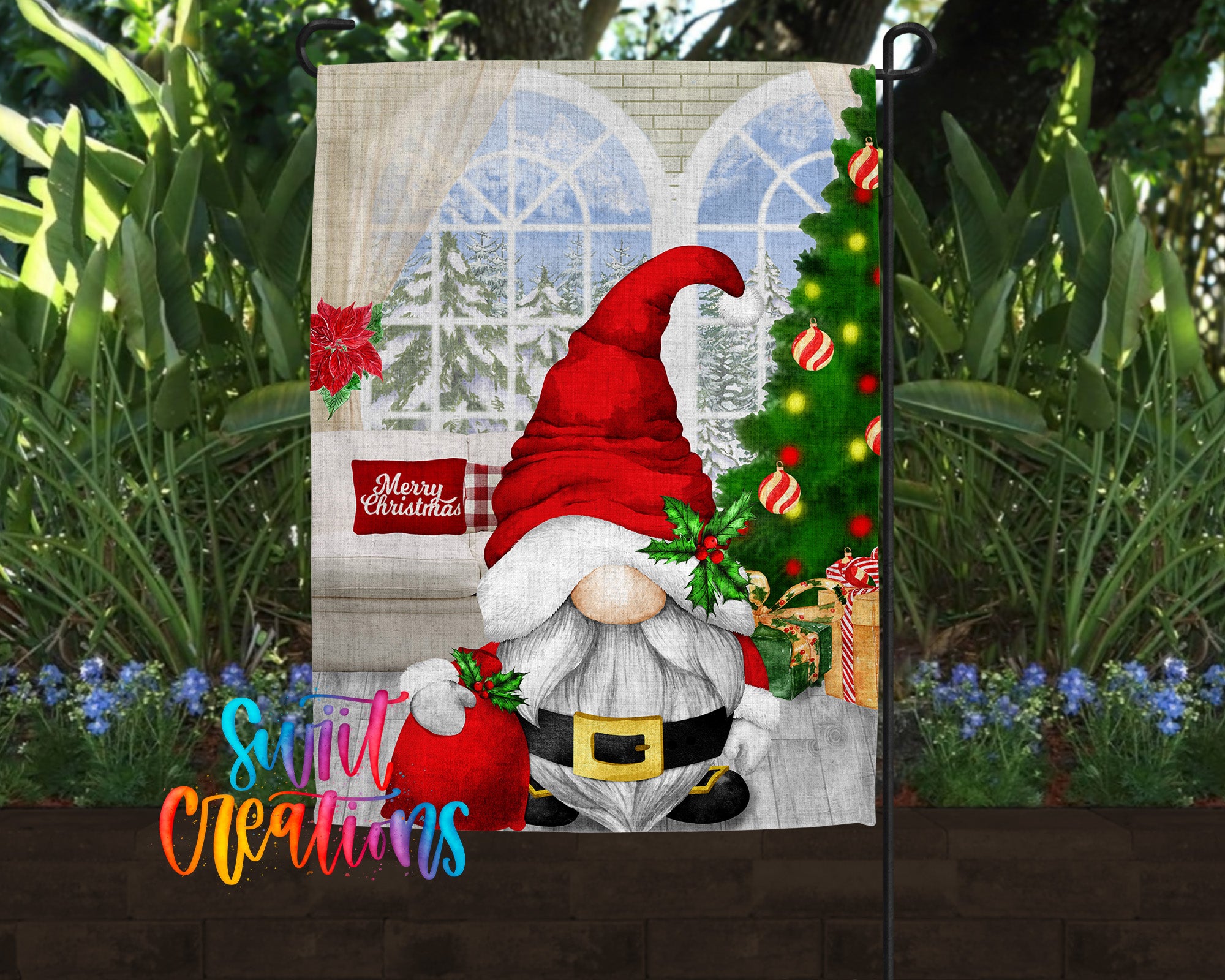 A Christmas-themed garden decoration featuring a gnome holding a sack of presents and a Christmas tree in the background.
