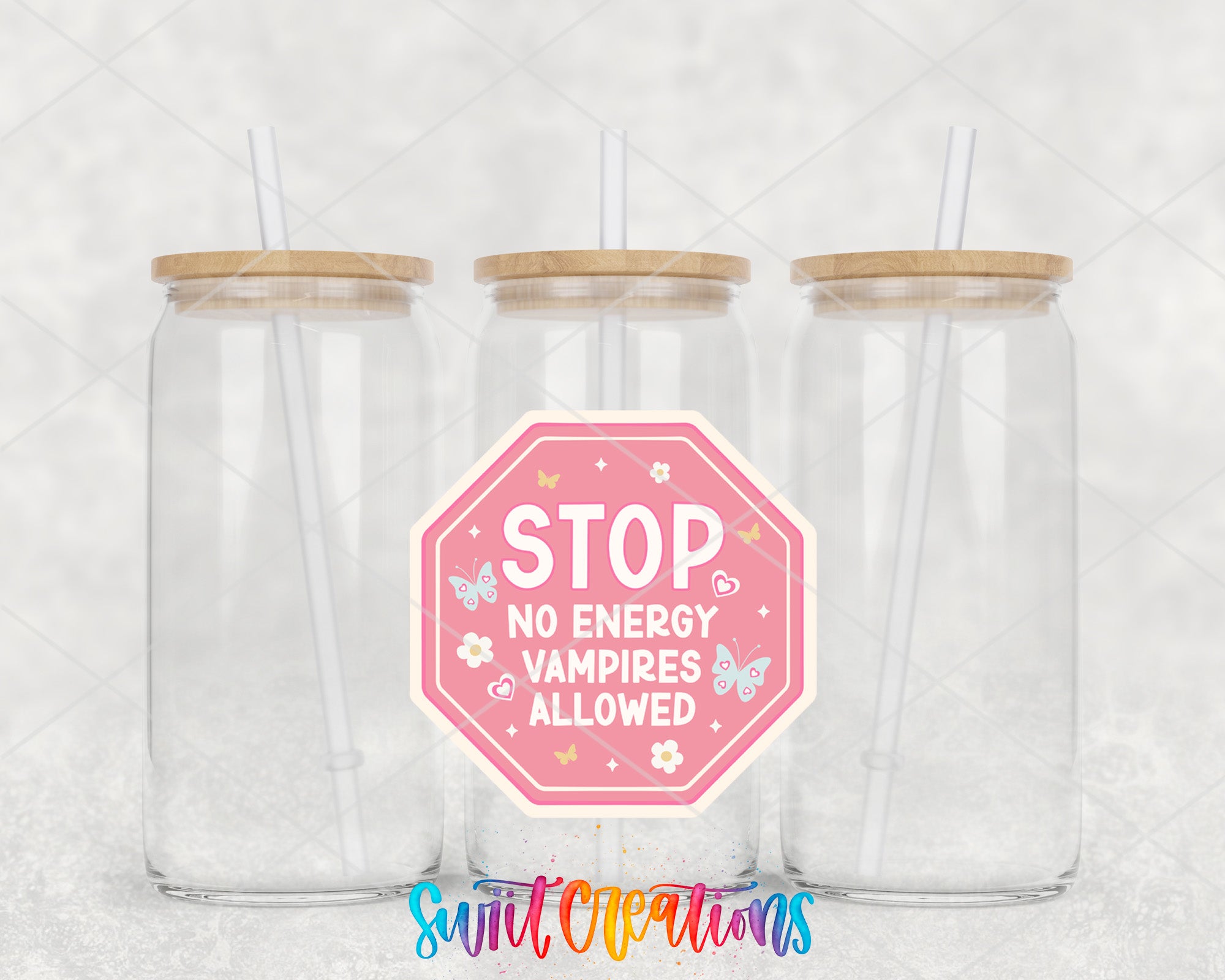 a couple of glass jars with straws inside of them