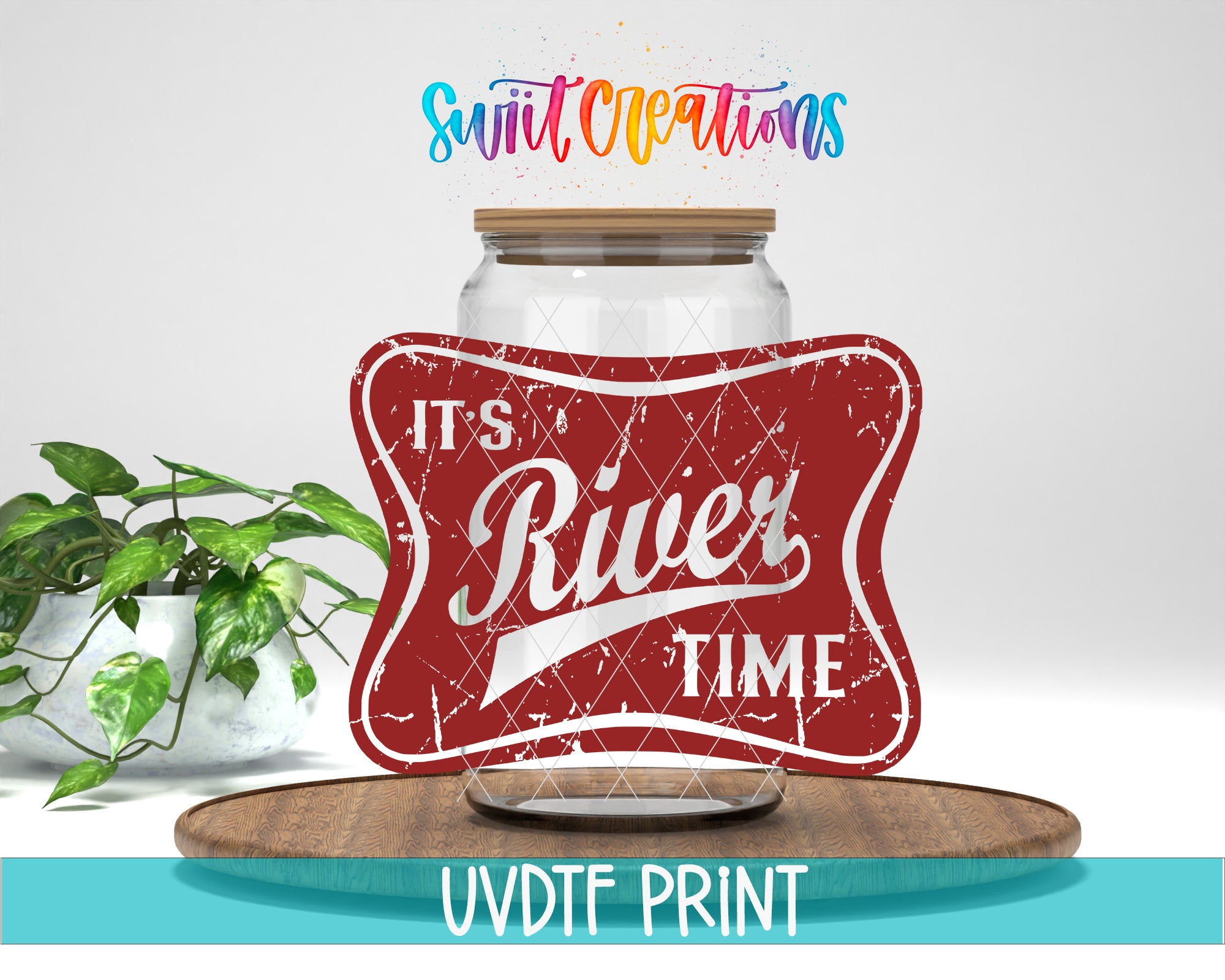 a red vintage-style sign with the text "It's River Time" and a wooden tray with a plant on it. The sign is placed on a wooden surface, and there is a plant in the background.