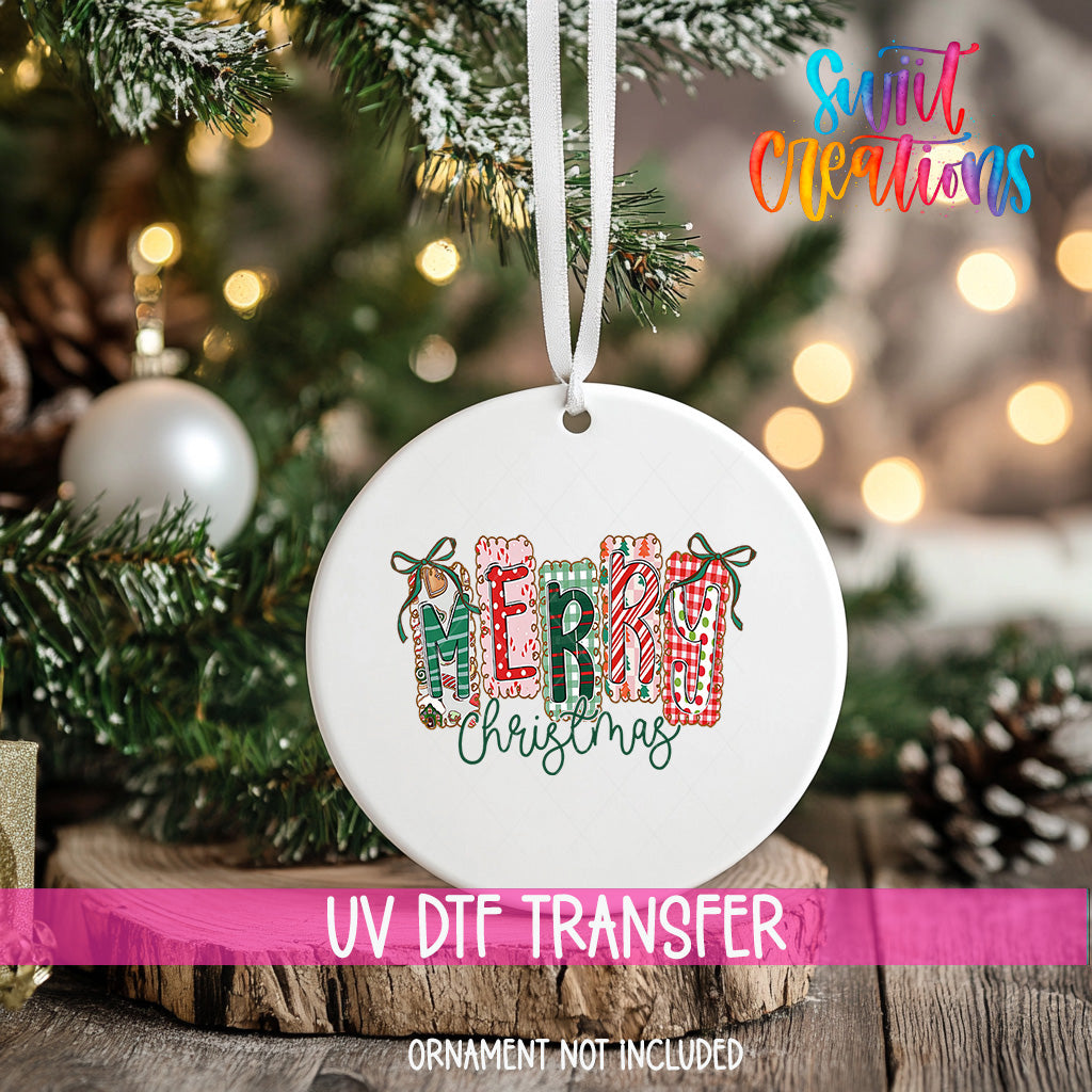 A white Christmas ornament with the word "MERRY" written on it, hanging on a tree branch with other ornaments and lights in the background.