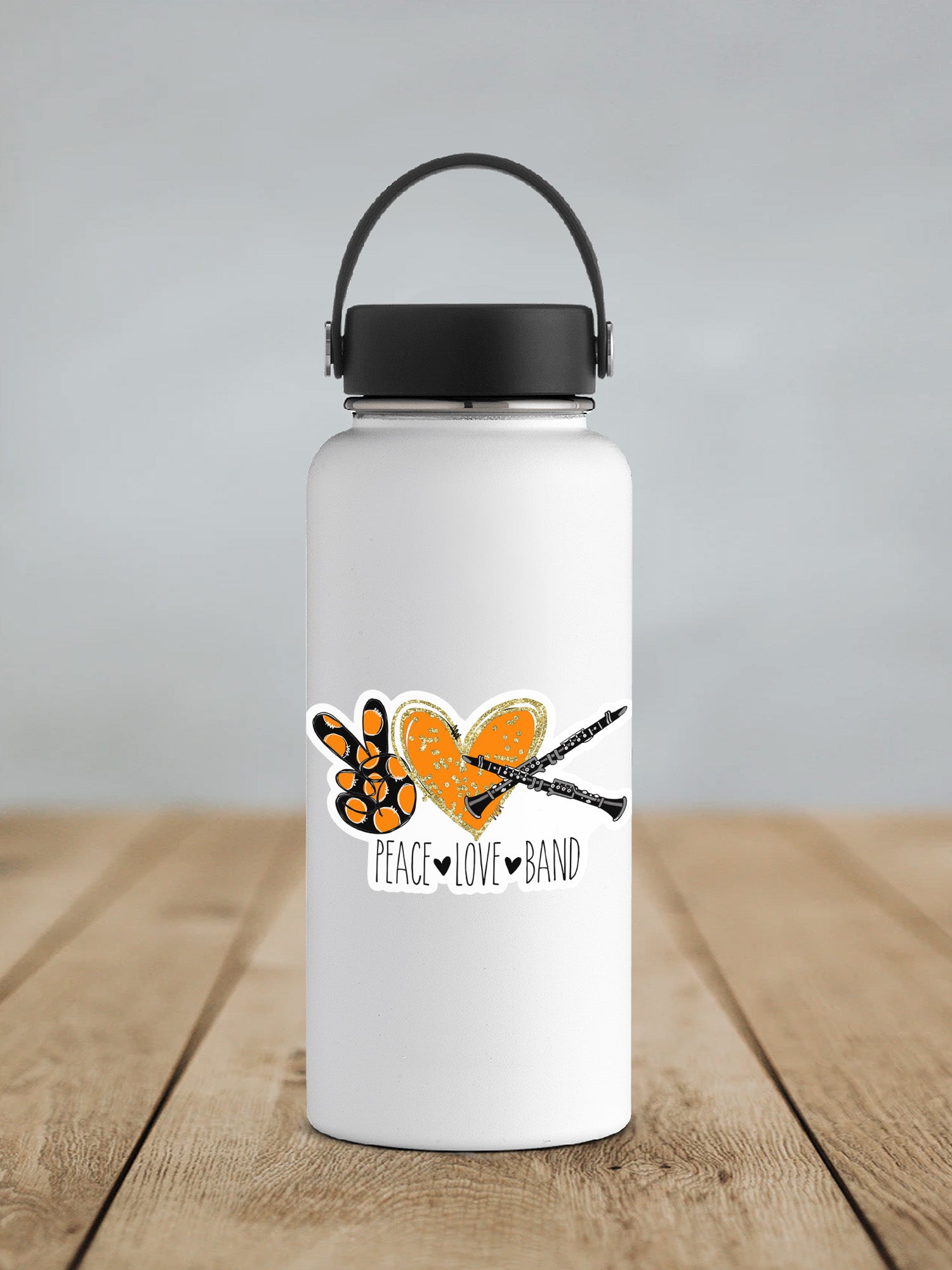 a white water bottle sitting on top of a wooden table