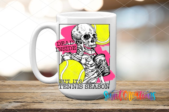 a coffee mug with a skeleton holding a tennis ball