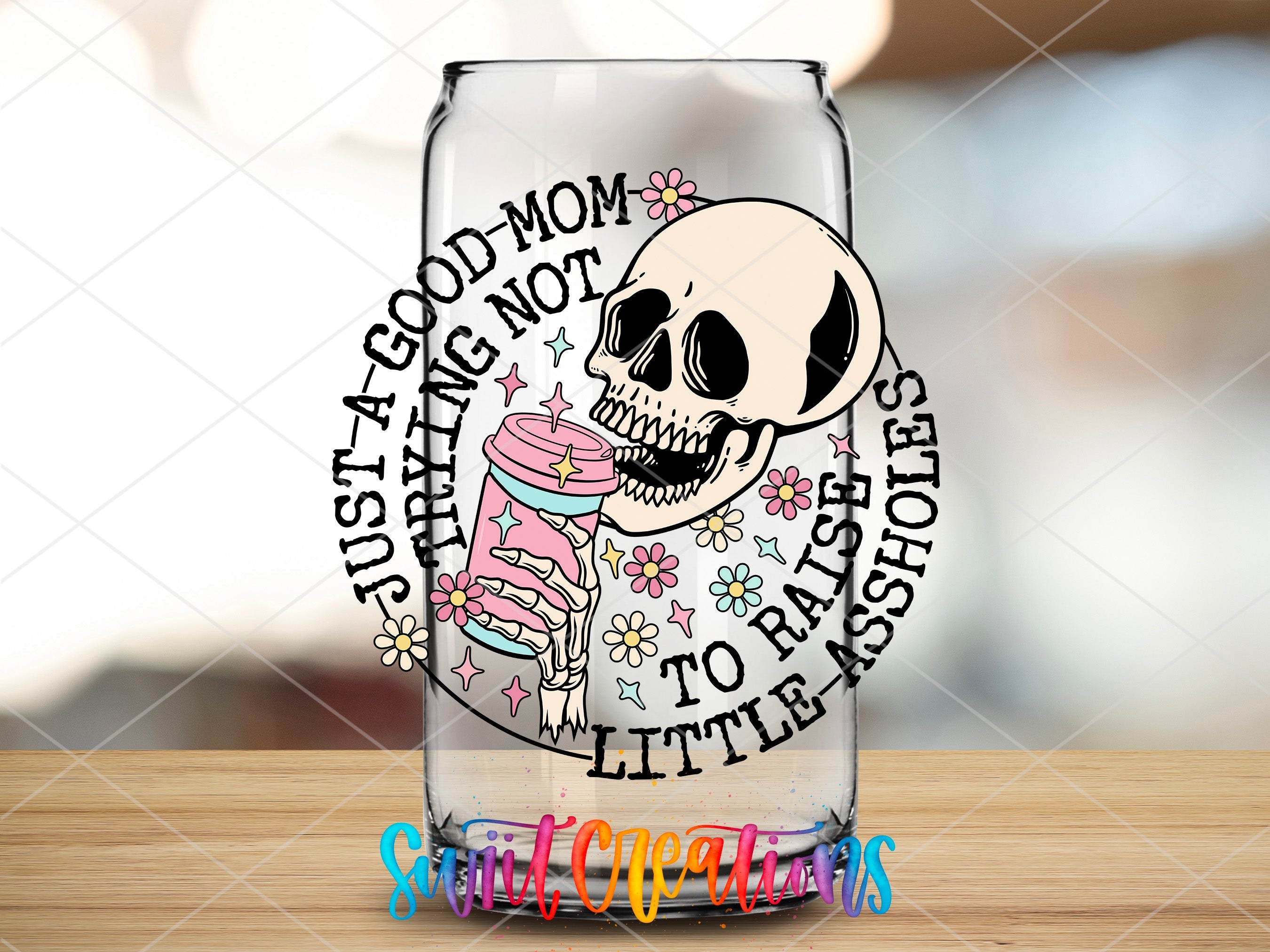 a glass with a skull and a cupcake on it