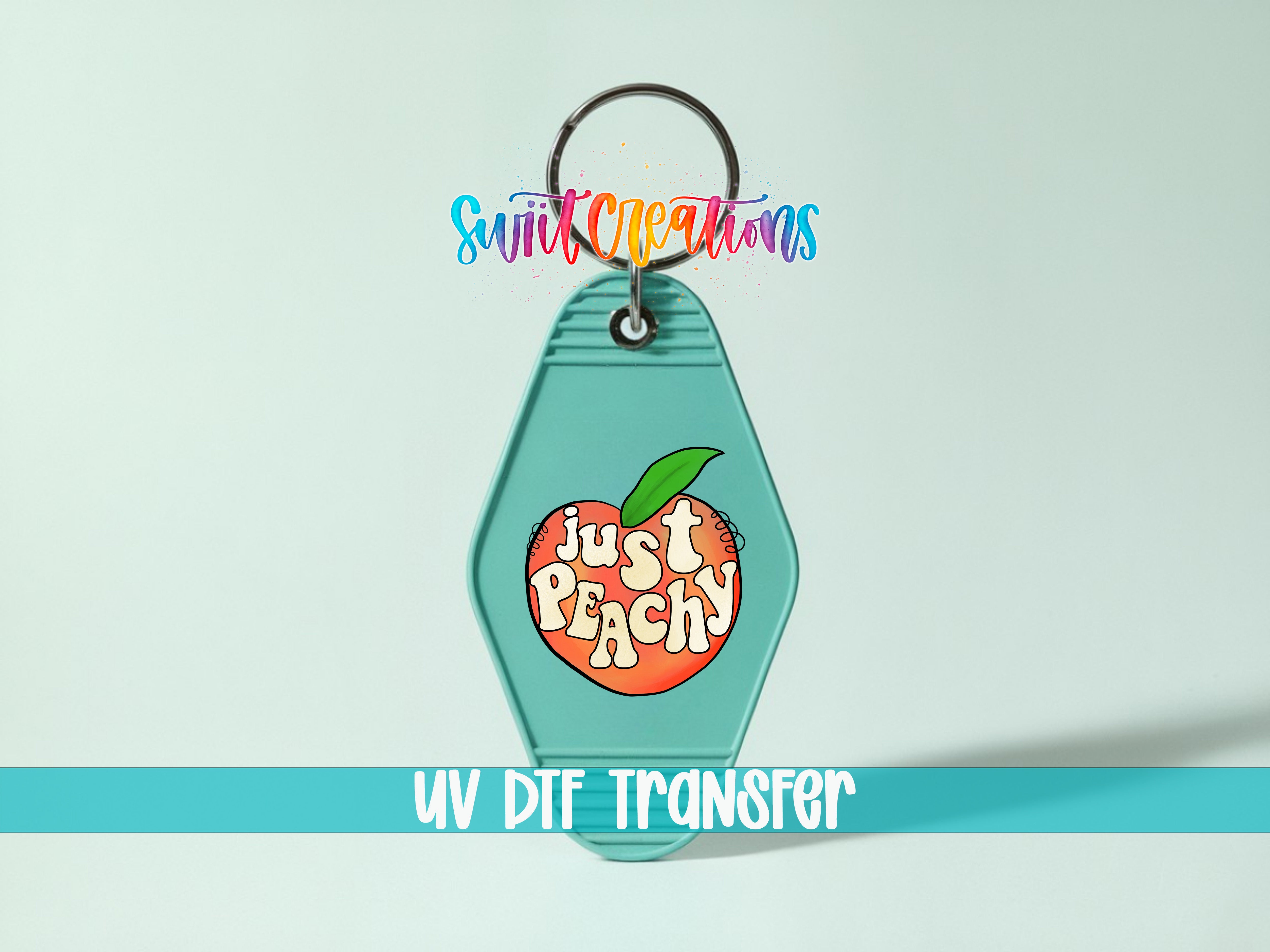 A keychain with a peach design and the text "Just Peachy" printed on it.