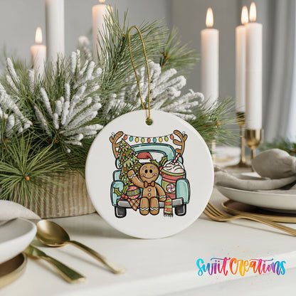 A white ceramic ornament featuring a gingerbread man in a truck, surrounded by pine branches and candles, placed on a table with other tableware.