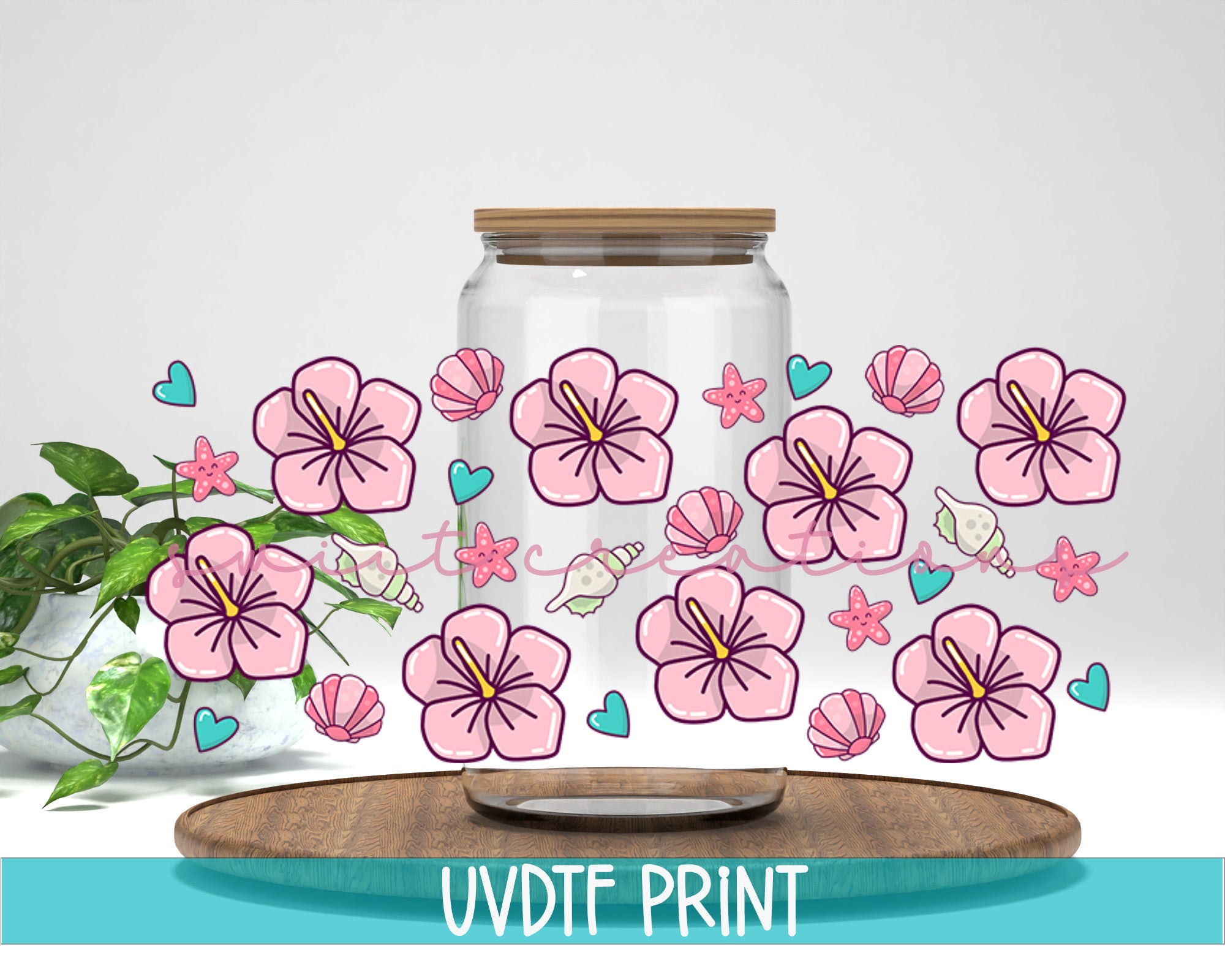 a vase filled with pink flowers on top of a wooden table