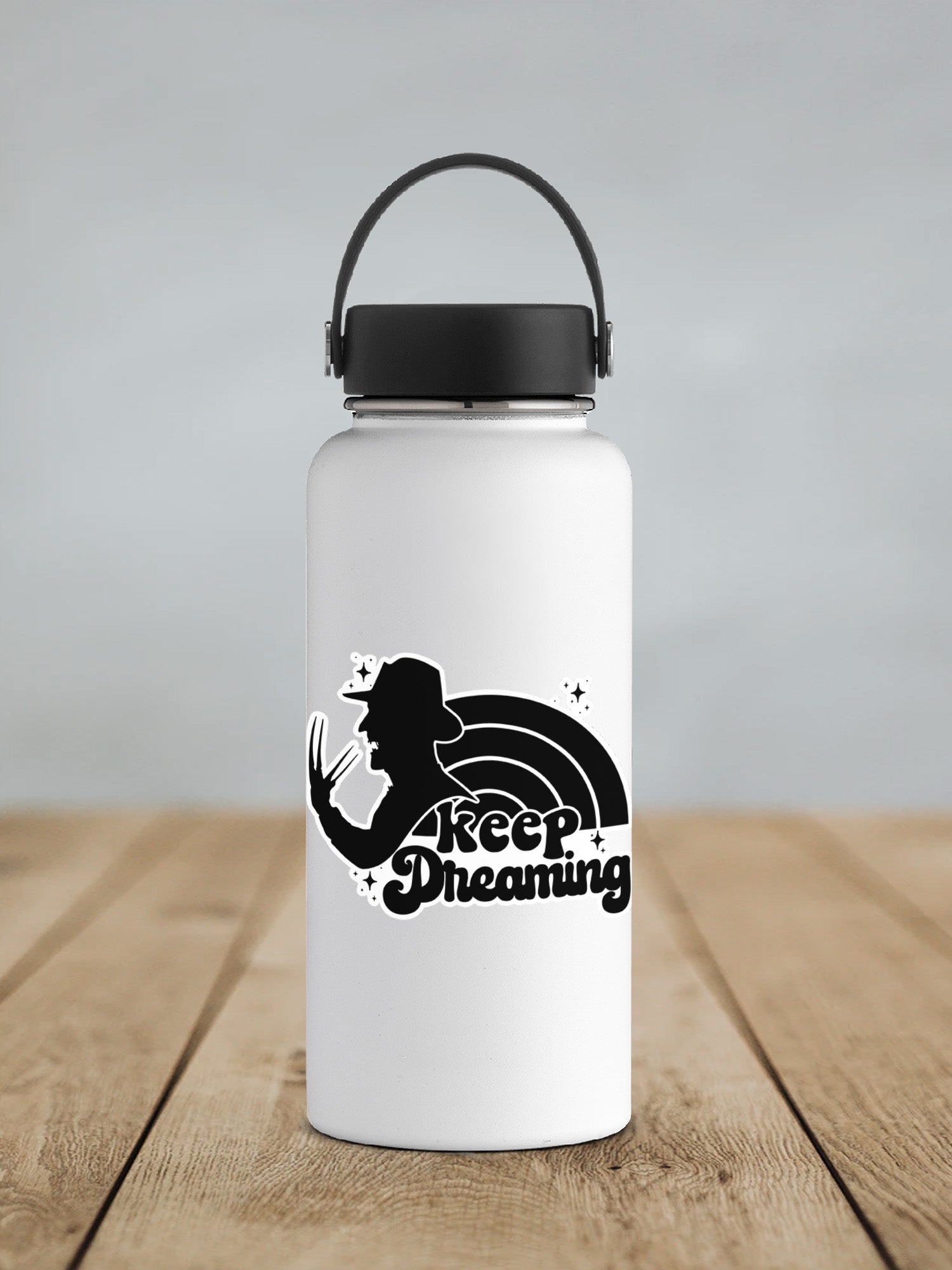 a white water bottle sitting on top of a wooden table