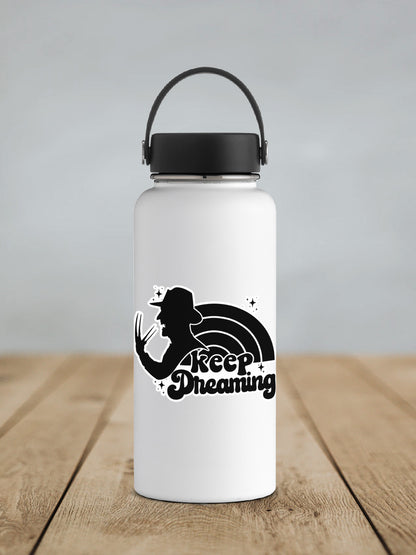 Keep Dreaming sticker on a white insulated water bottle