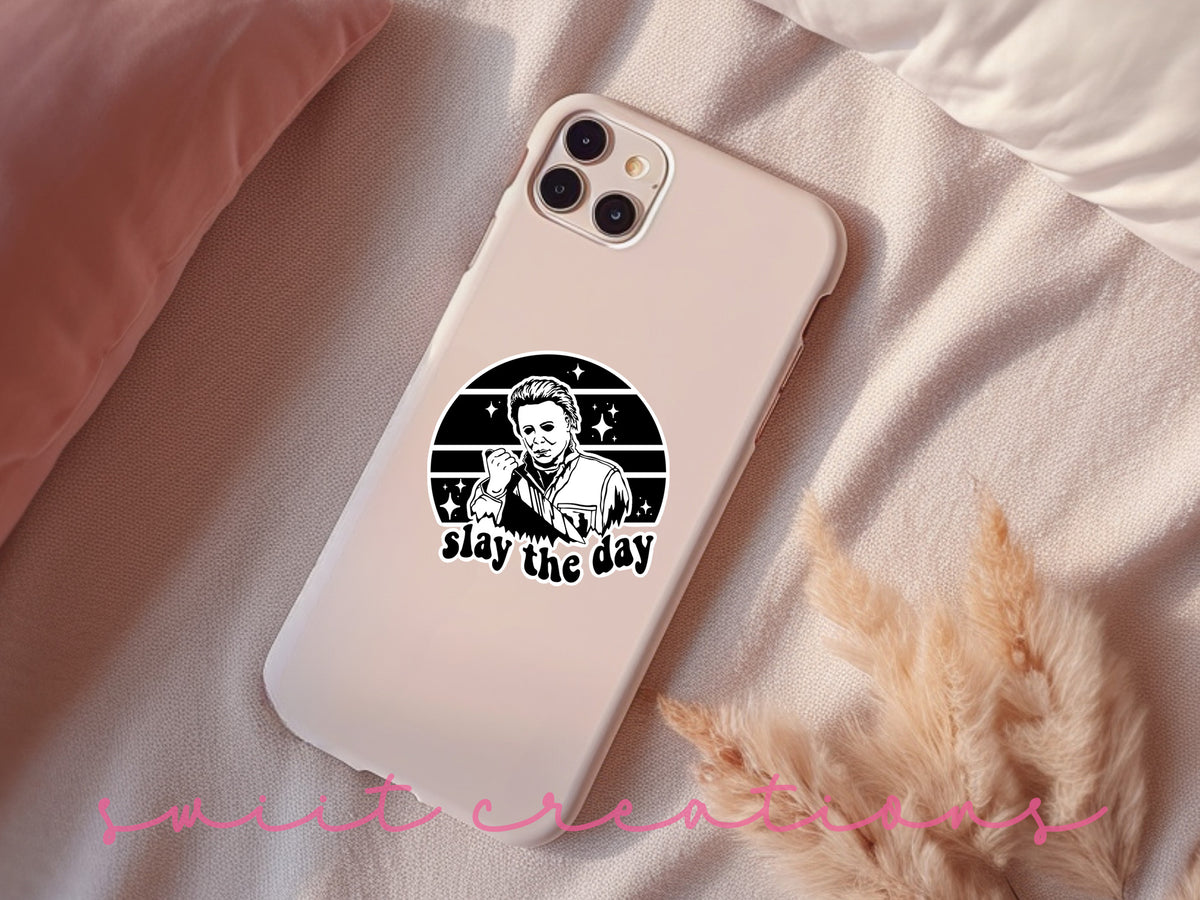 Slay the Day sticker on a pink phone case