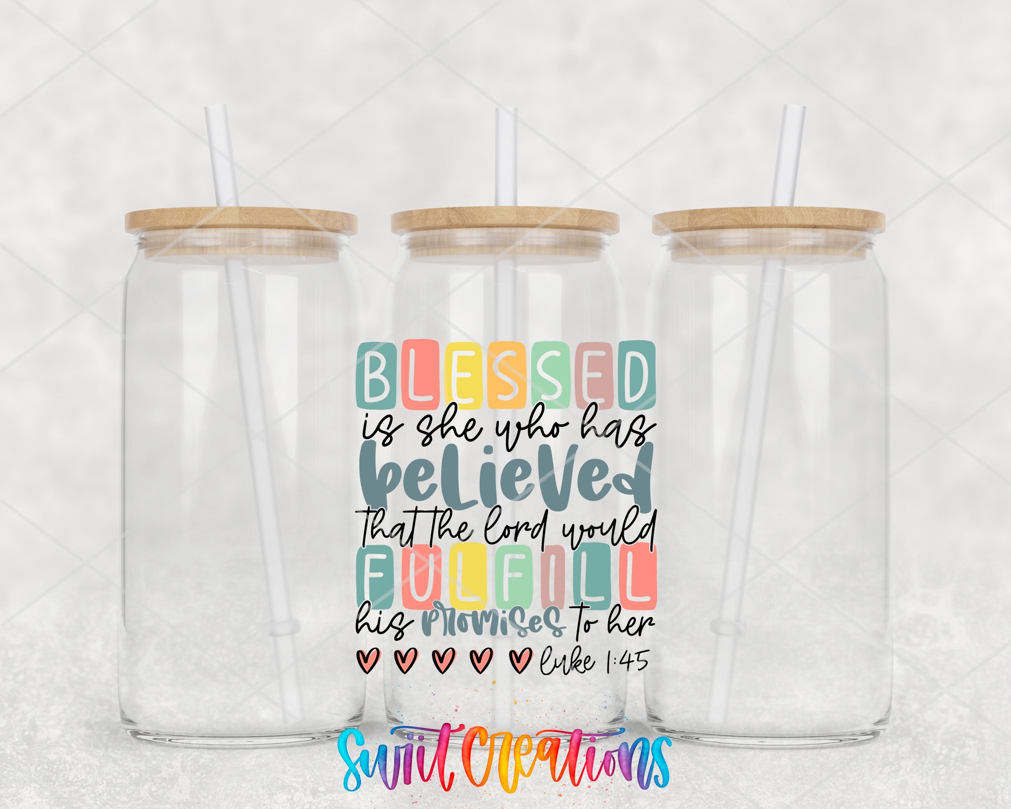 two clear tumblers with colorful lettering on them