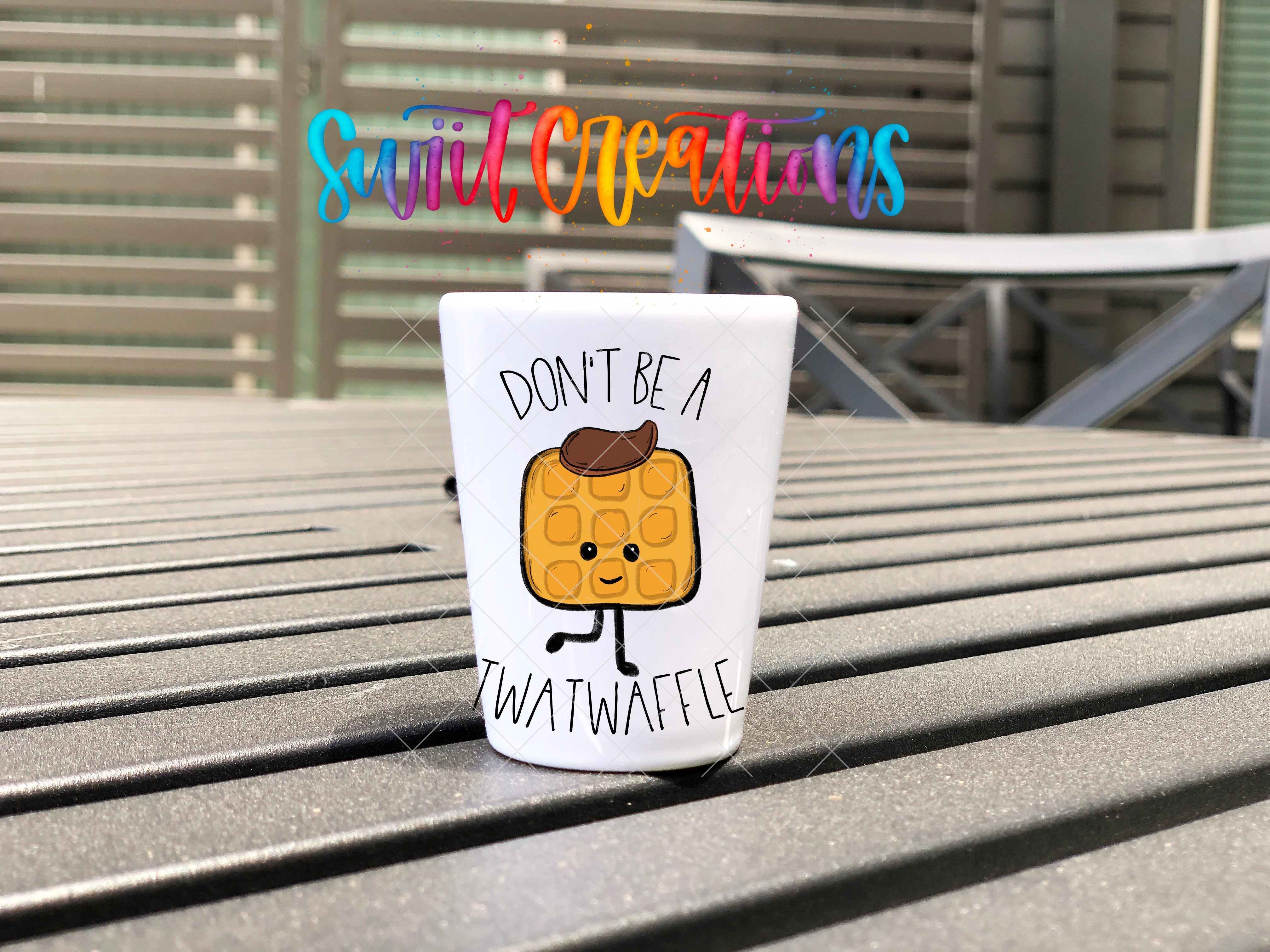 a coffee cup sitting on top of a wooden table