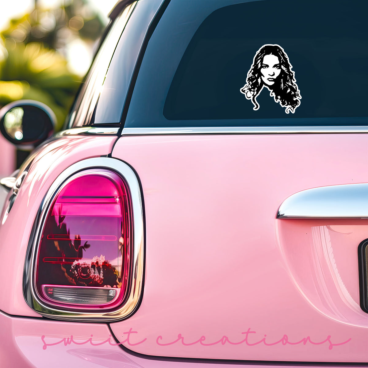 Alexis Portrait sticker on the back window of a pink car
