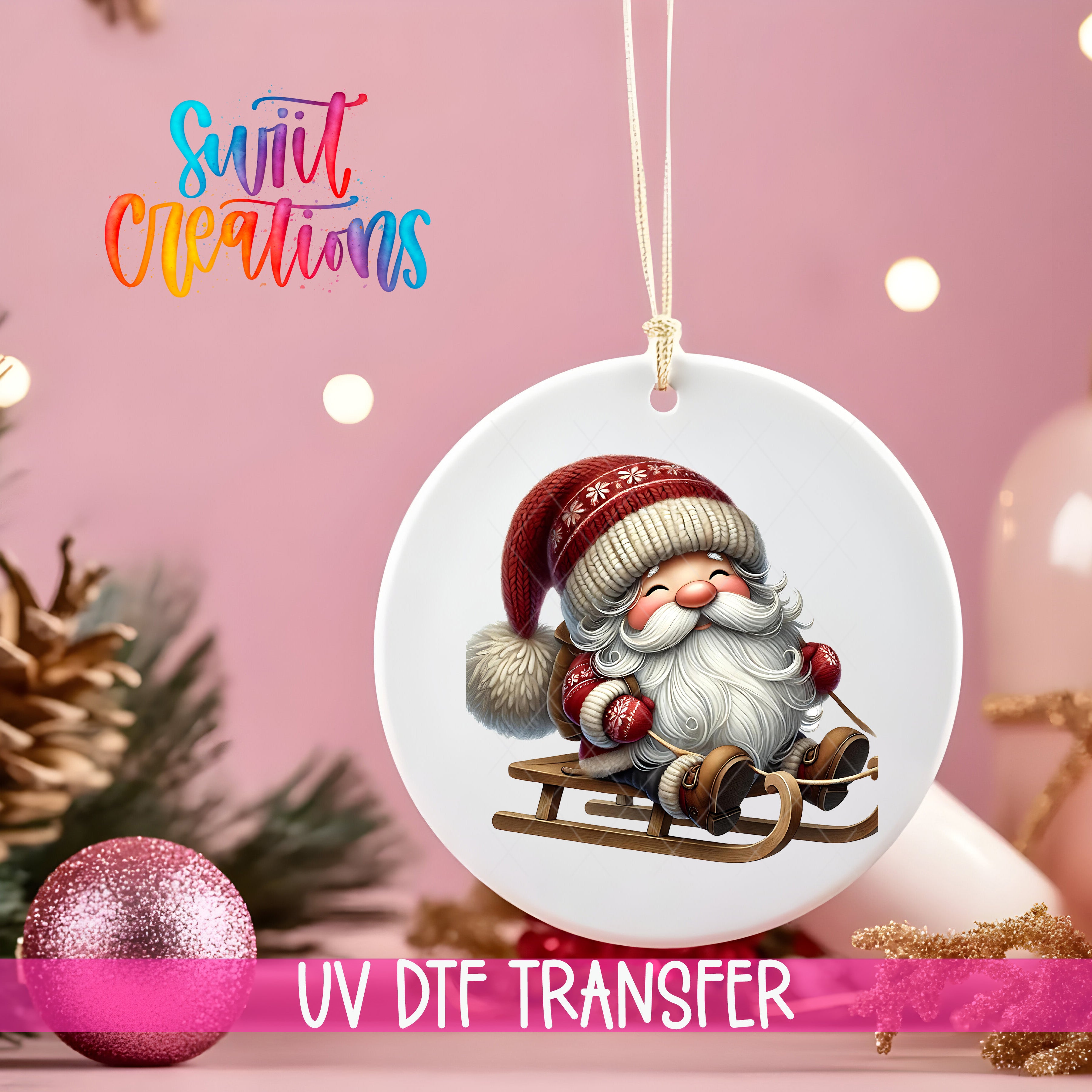A white ornament with a smiling Santa Claus figure on a sled, surrounded by Christmas decorations and a pink background.