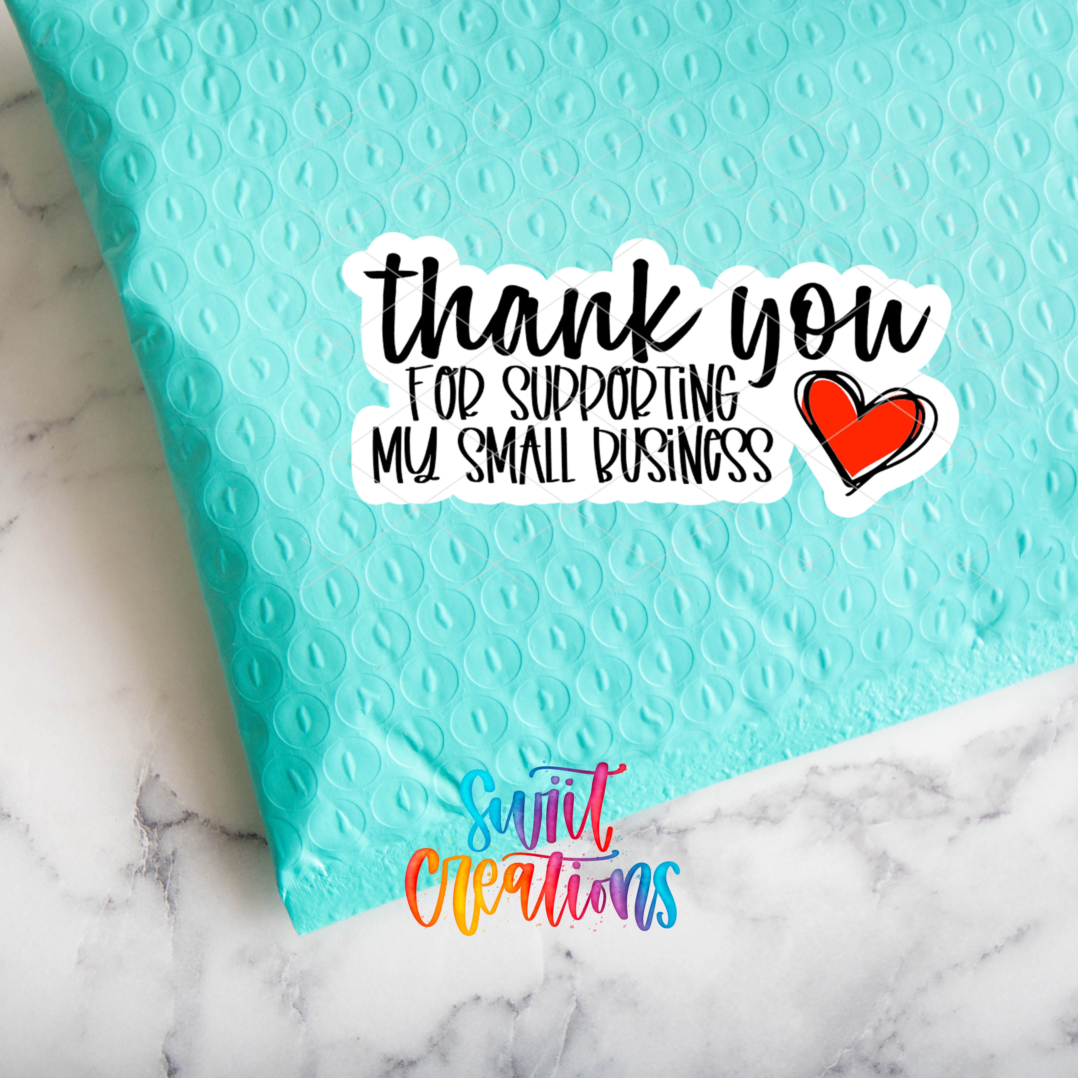 a blue envelope with a thank you for shopping my small business sticker on it