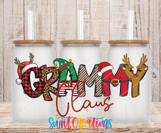 a couple of christmas mugs sitting on top of a wooden table